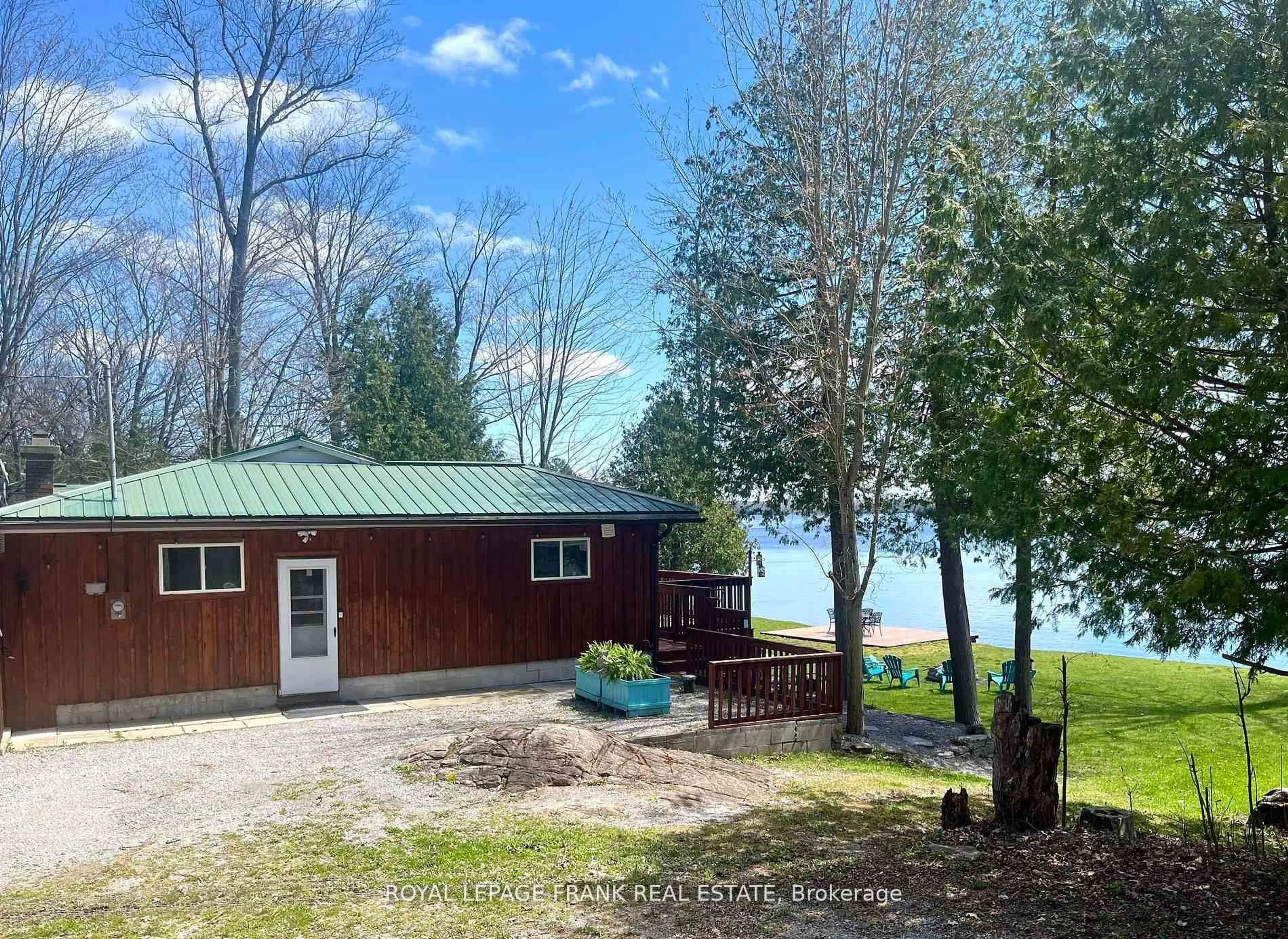 A pic from outside/outdoor area/front of a property/back of a property/a pic from drone, water/lake/river/ocean view for 95 Fire Route 12, Trent Lakes Ontario K0L 1J0