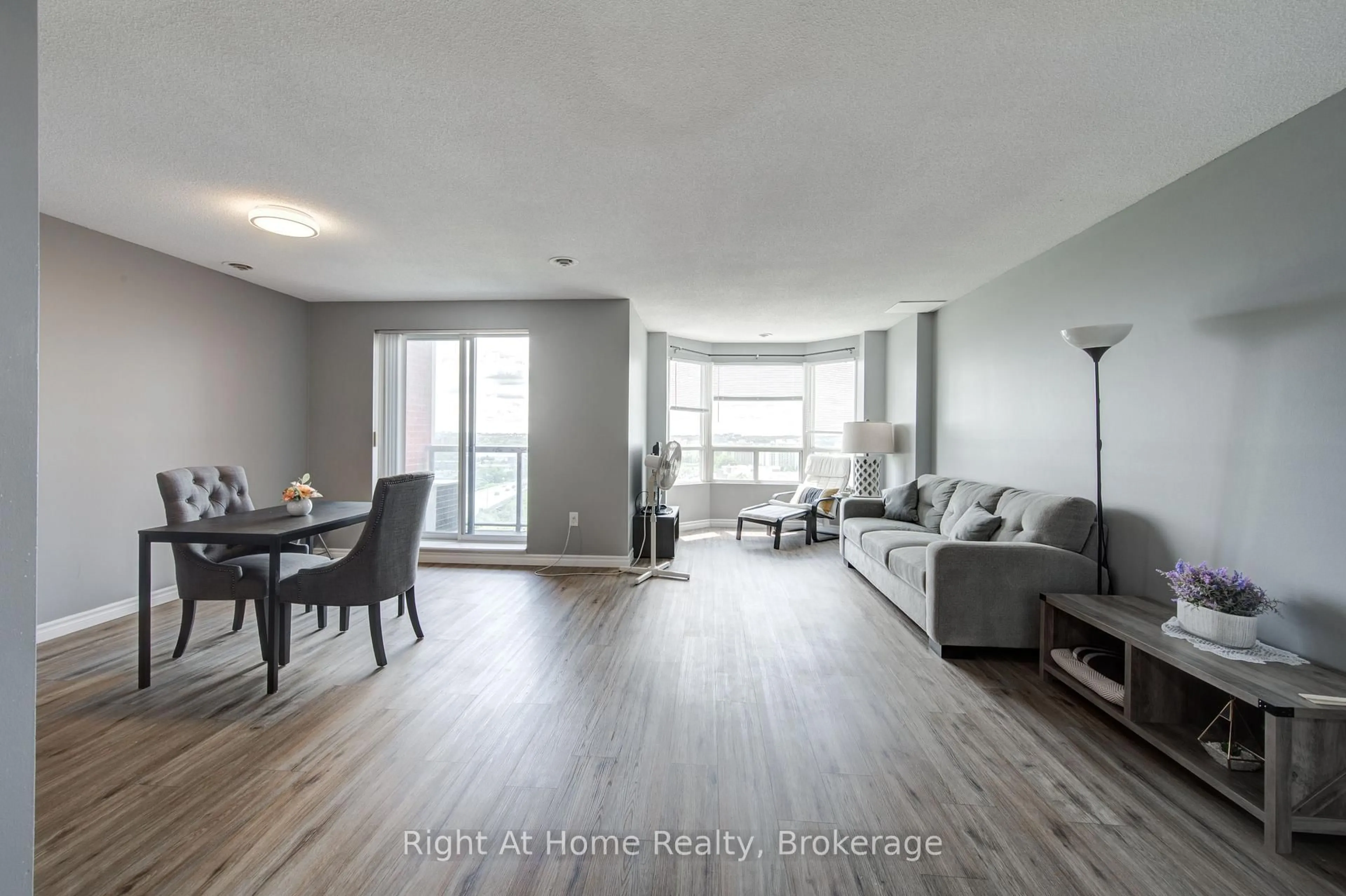 Living room with furniture, wood/laminate floor for 30 Chapman Crt #1104, London North Ontario N6G 4Y4