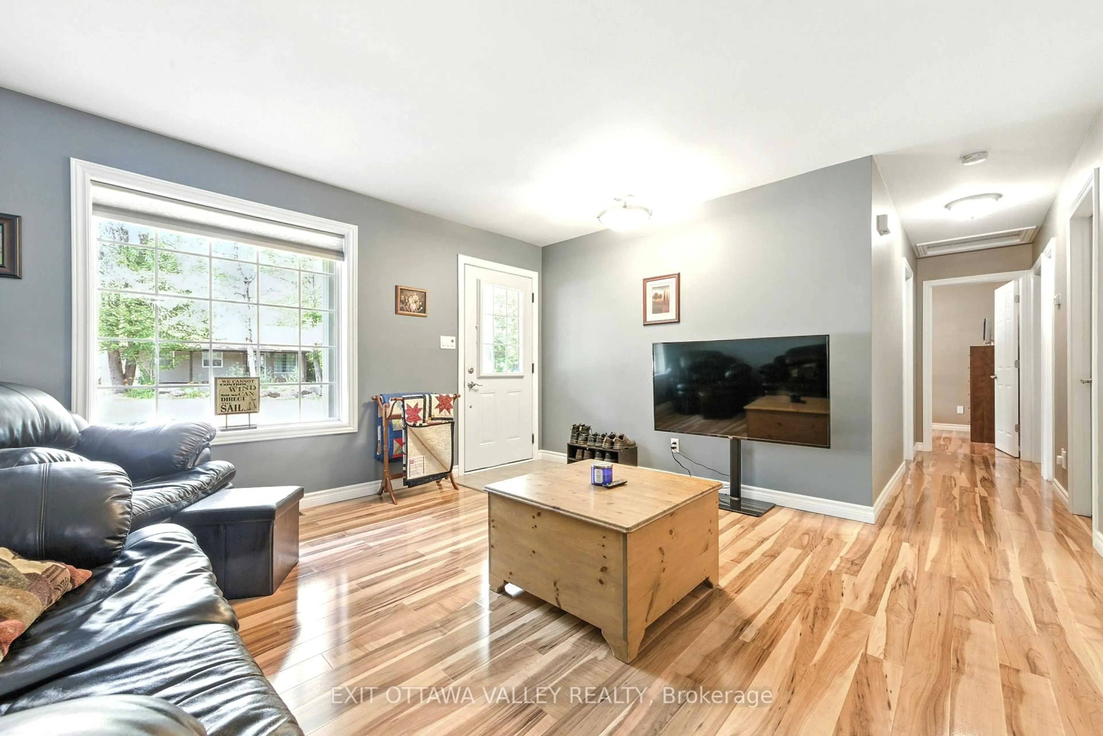 Living room with furniture, wood/laminate floor for 57 Legere Dr, Deep River Ontario K0J 1P0