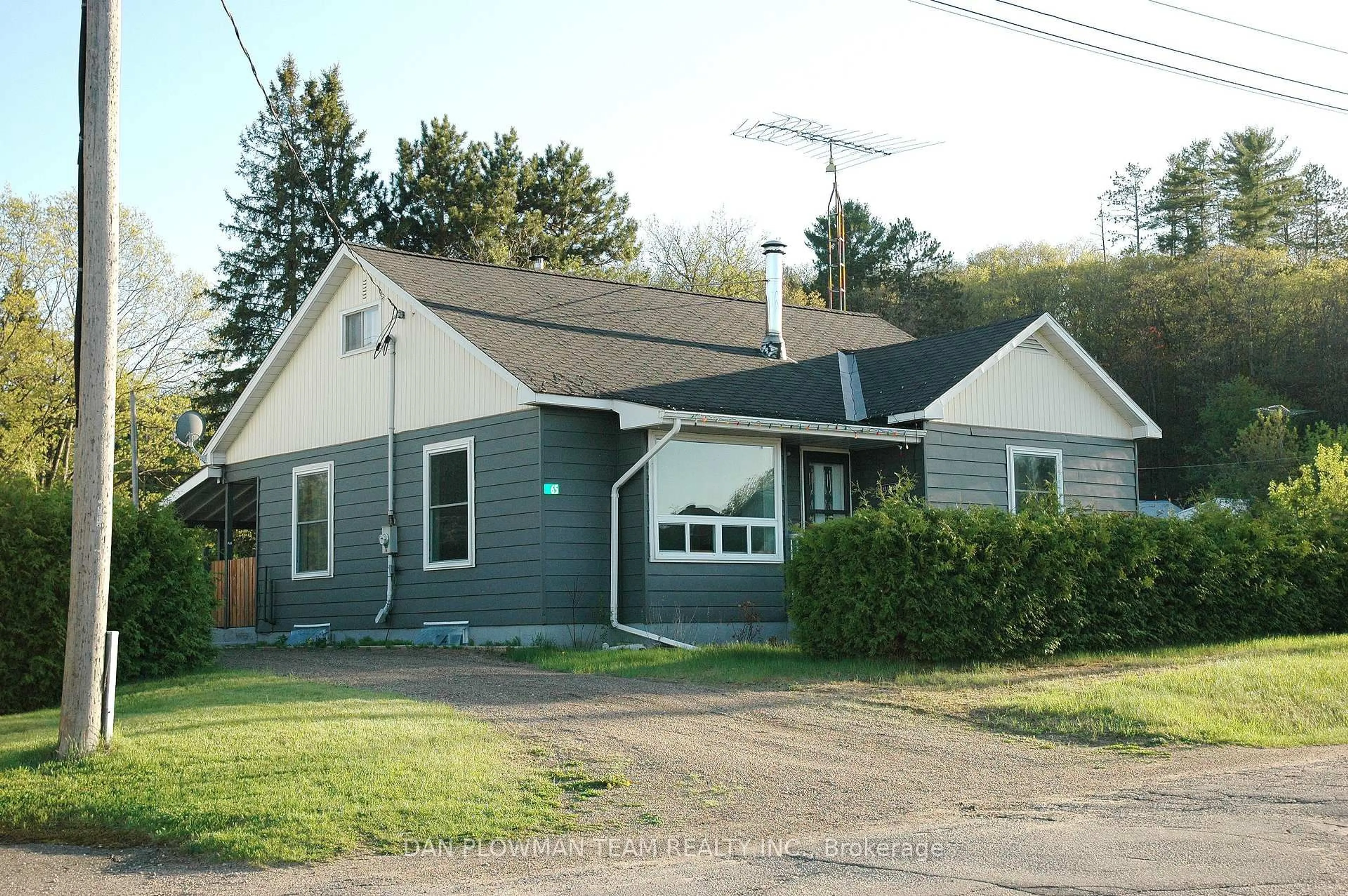 Home with vinyl exterior material, street for 65 Inglis St, Whitney Ontario K0J 2M0