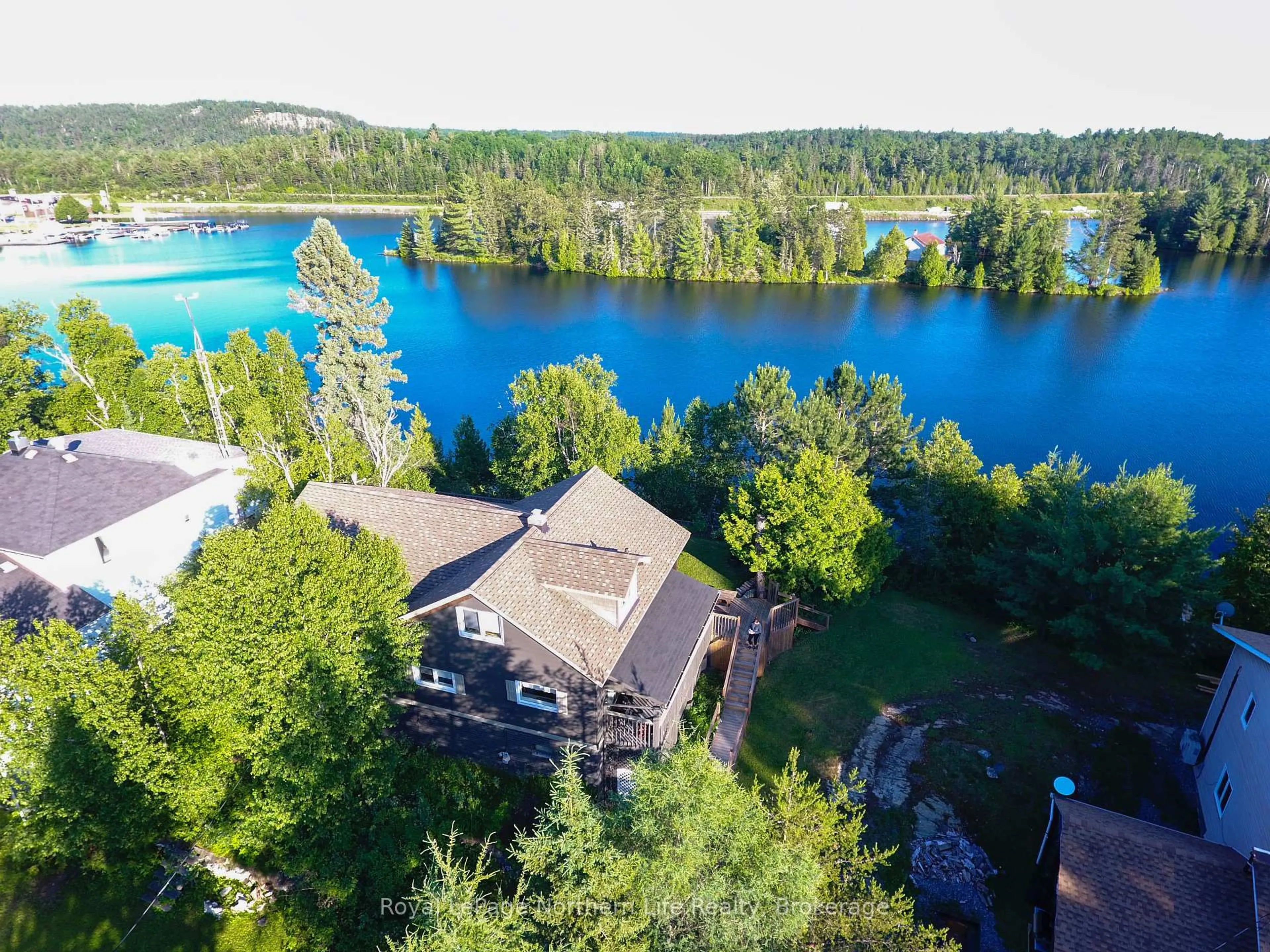 A pic from outside/outdoor area/front of a property/back of a property/a pic from drone, water/lake/river/ocean view for 51 Lakeshore Dr, Temagami Ontario P0H 2H0