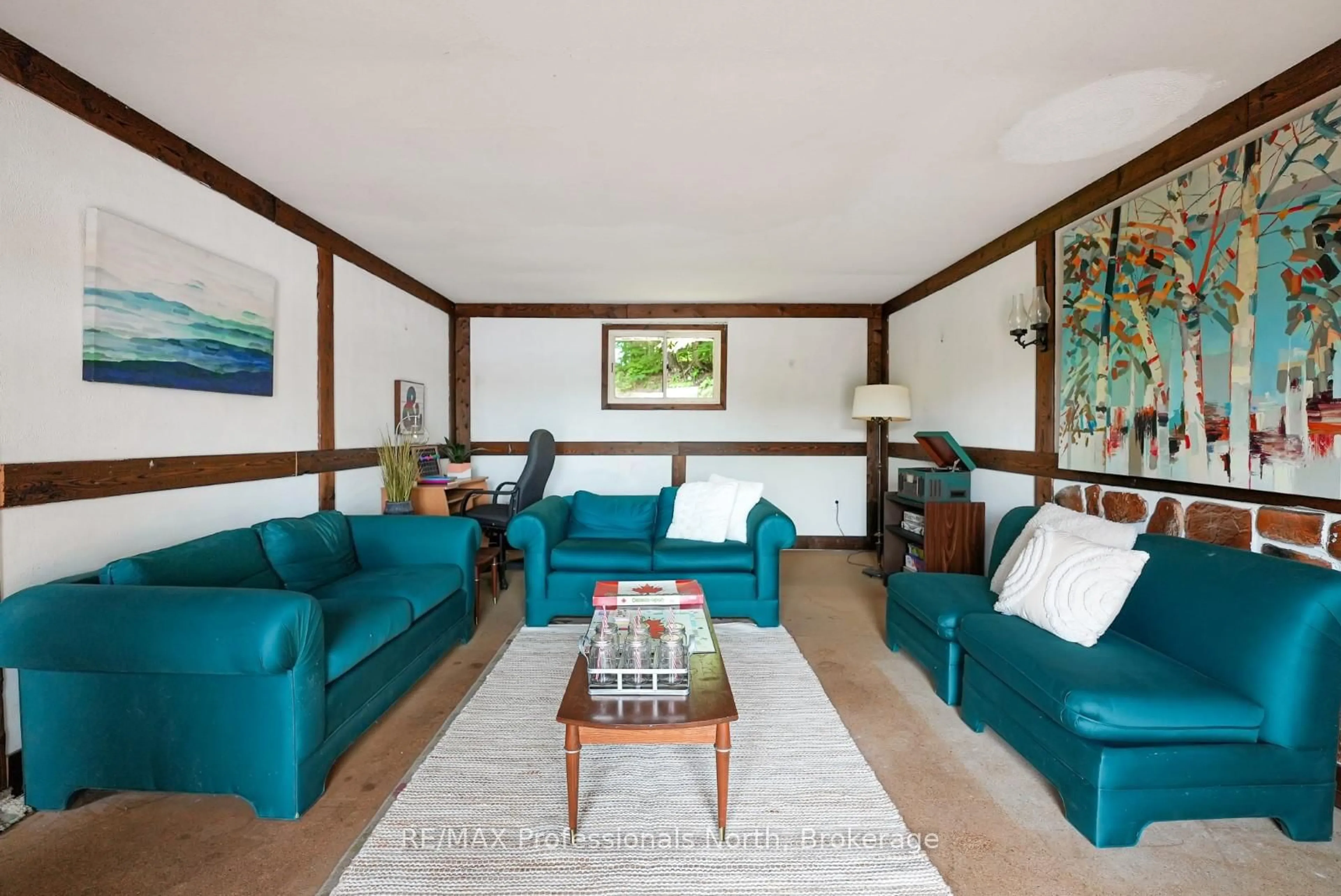 Living room with furniture, wood/laminate floor for 1020 Vinegar Hill Lane, Highlands East Ontario K0L 3C0