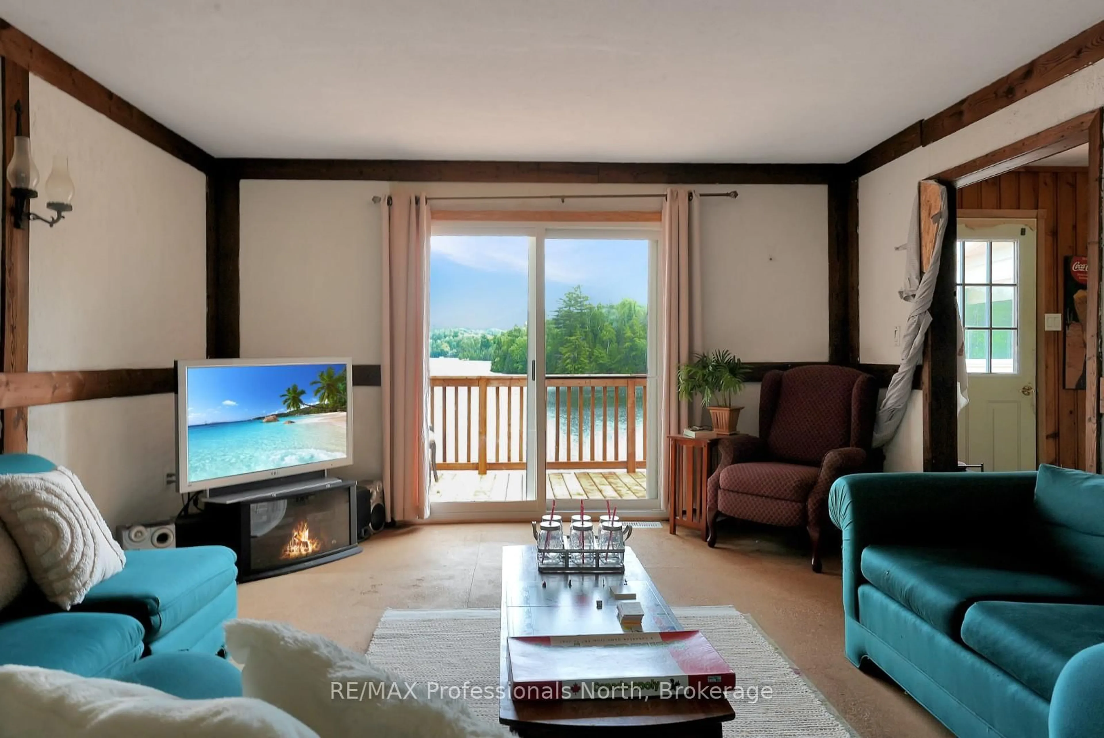 Living room with furniture, wood/laminate floor for 1020 Vinegar Hill Lane, Highlands East Ontario K0L 3C0