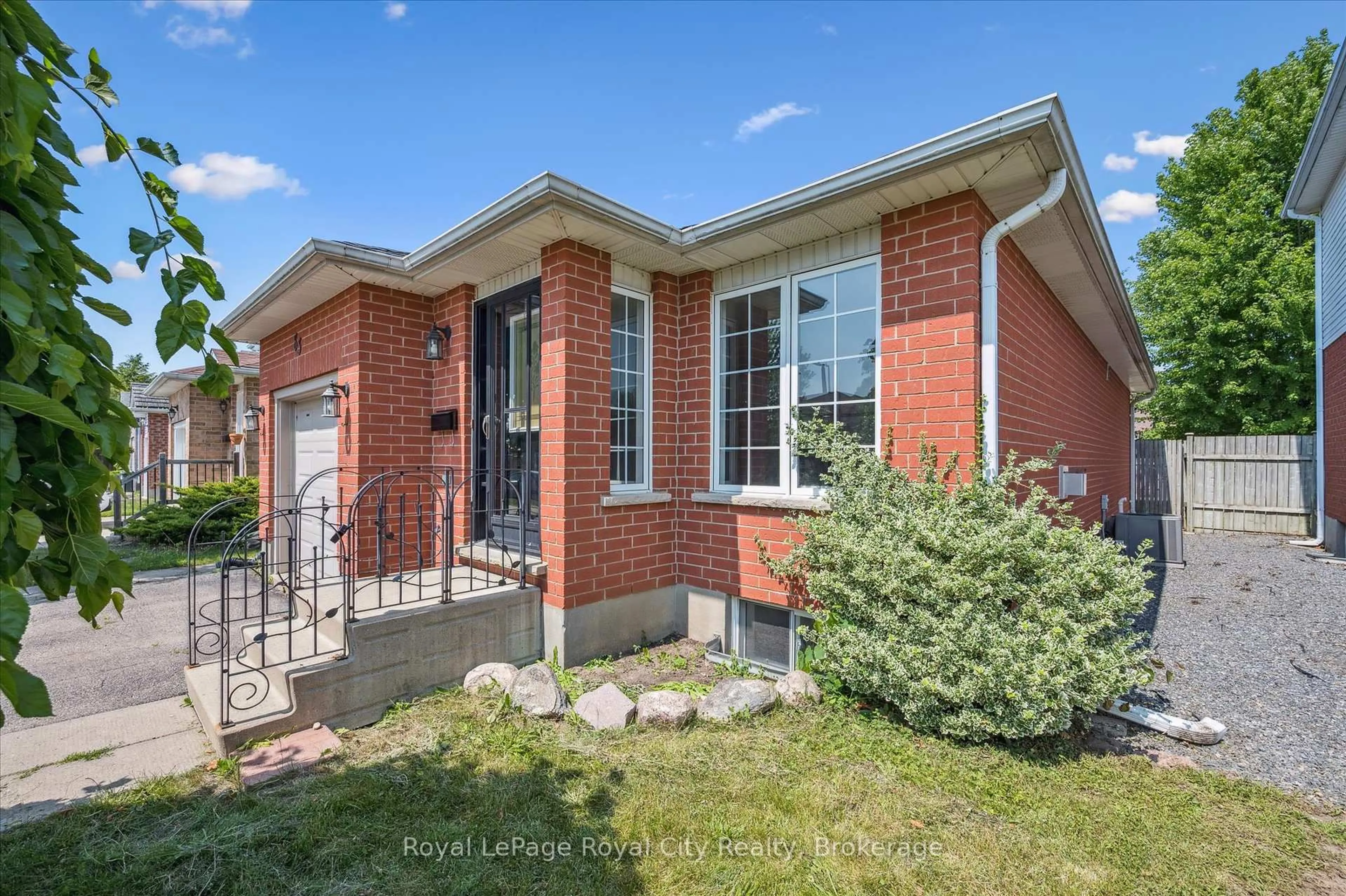 Home with brick exterior material, street for 83 Inverness Dr, Guelph Ontario N1E 6E4