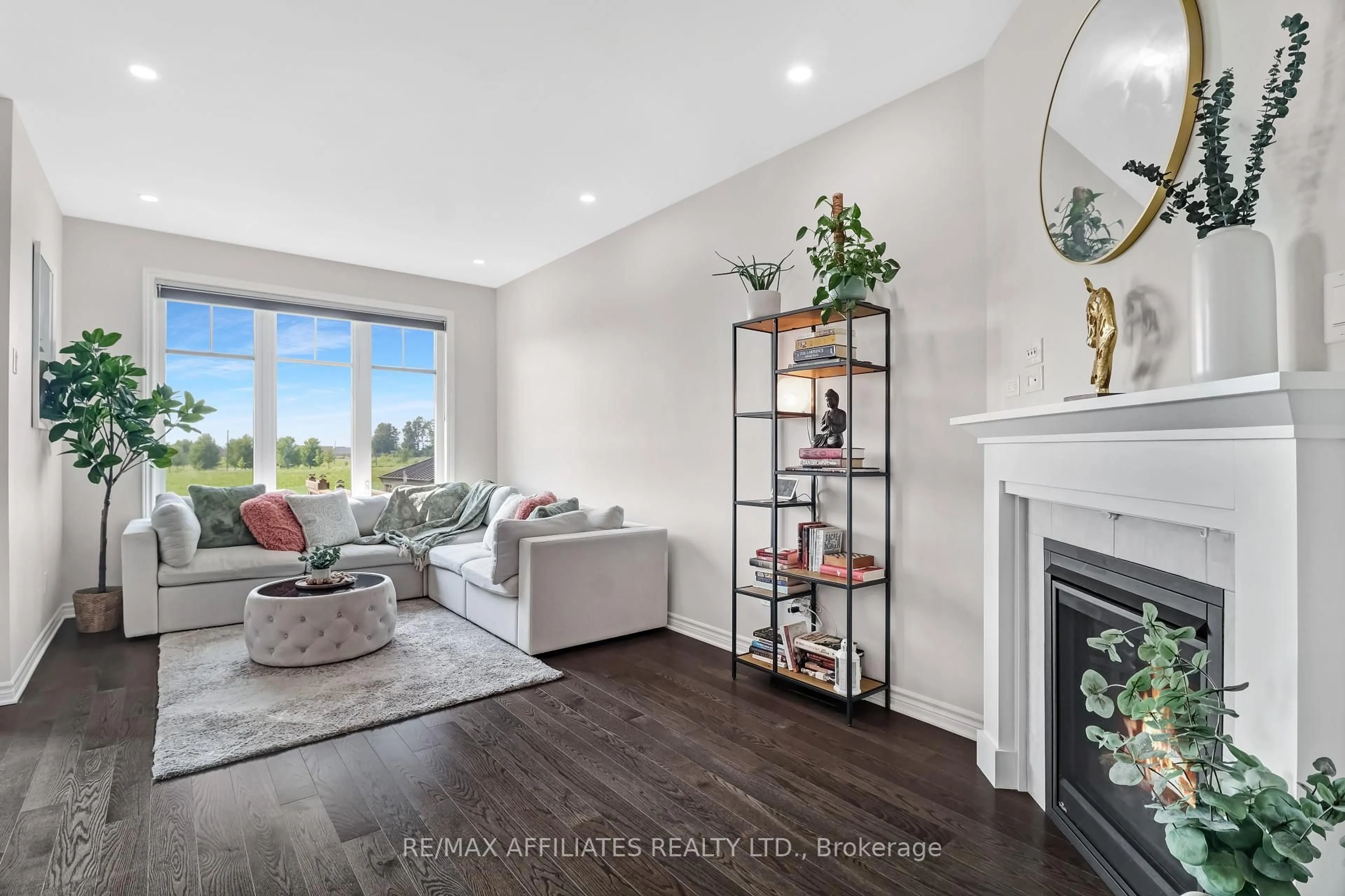 Living room with furniture, wood/laminate floor for 357 Mishawashkode St, Orleans Ontario K4A 1E9