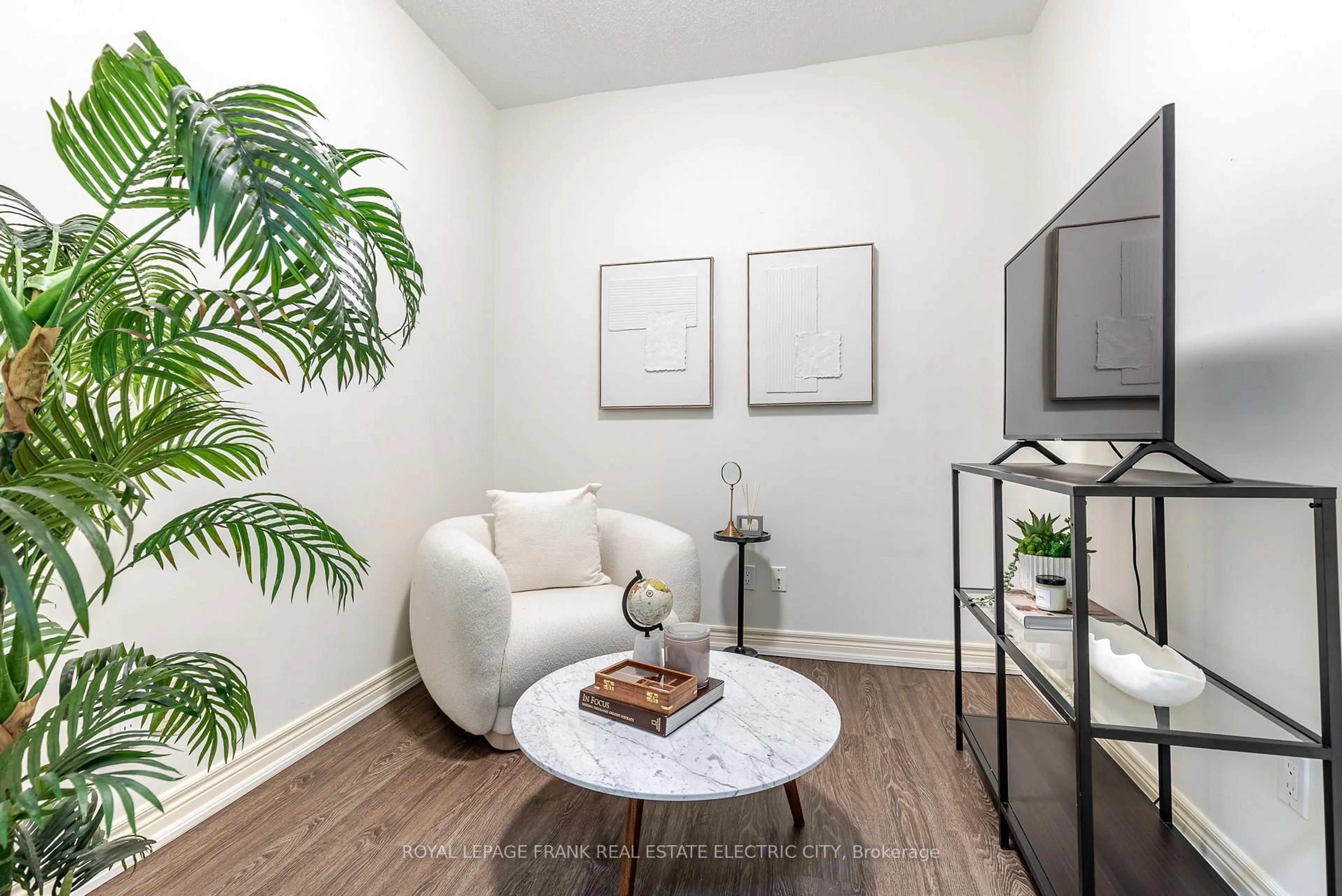 Living room with furniture, wood/laminate floor for 869 Clonsilla Ave #217, Peterborough West Ontario K9J 0B7