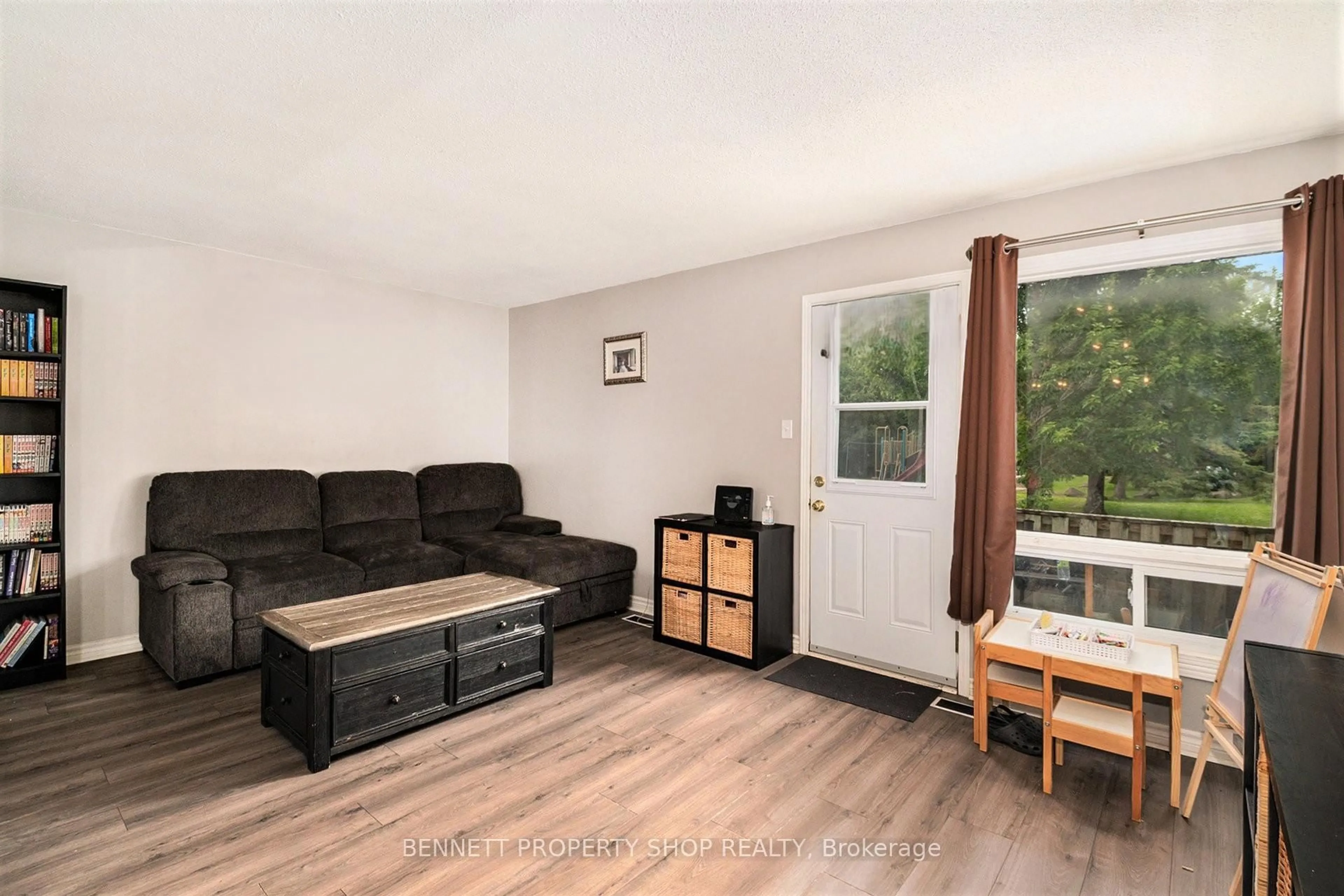 Living room with furniture, wood/laminate floor for 1707 Meadowbrook Rd #57, Ottawa Ontario K1B 4W6