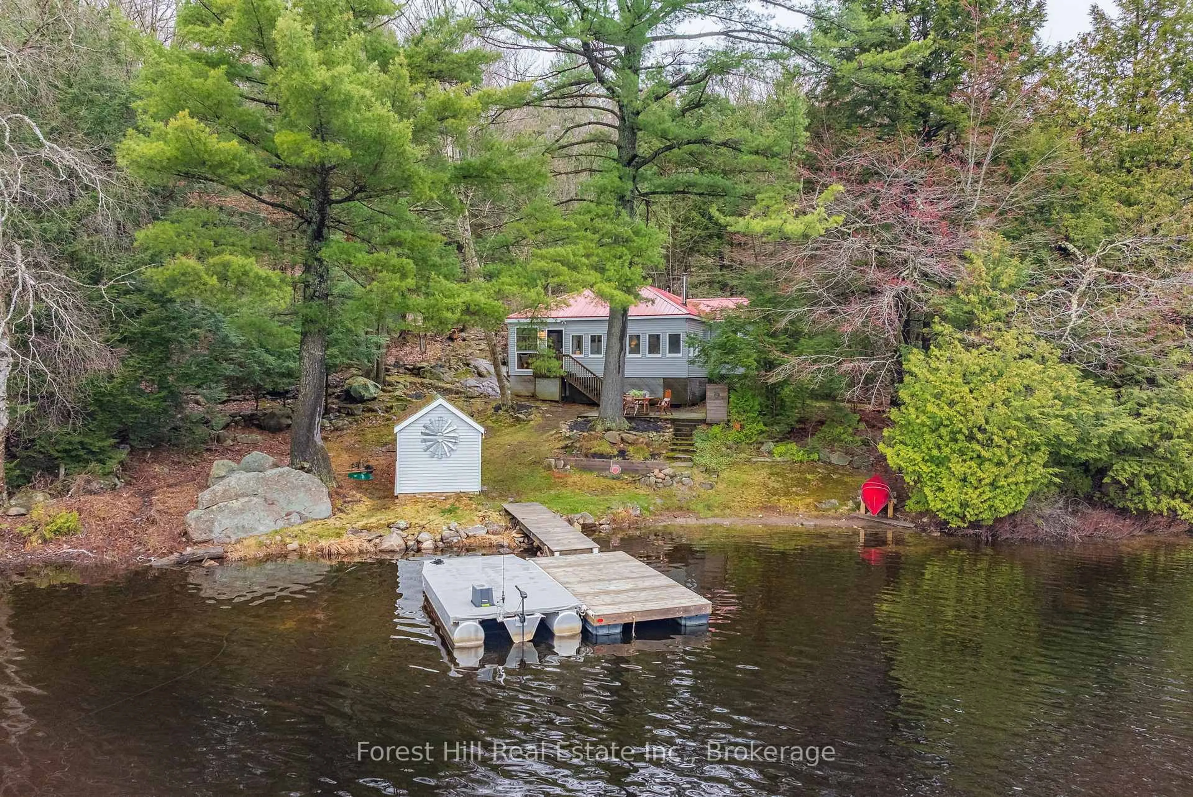 A pic from outside/outdoor area/front of a property/back of a property/a pic from drone, water/lake/river/ocean view for 1010 NEST Lane, Lake of Bays Ontario P0A 1E0