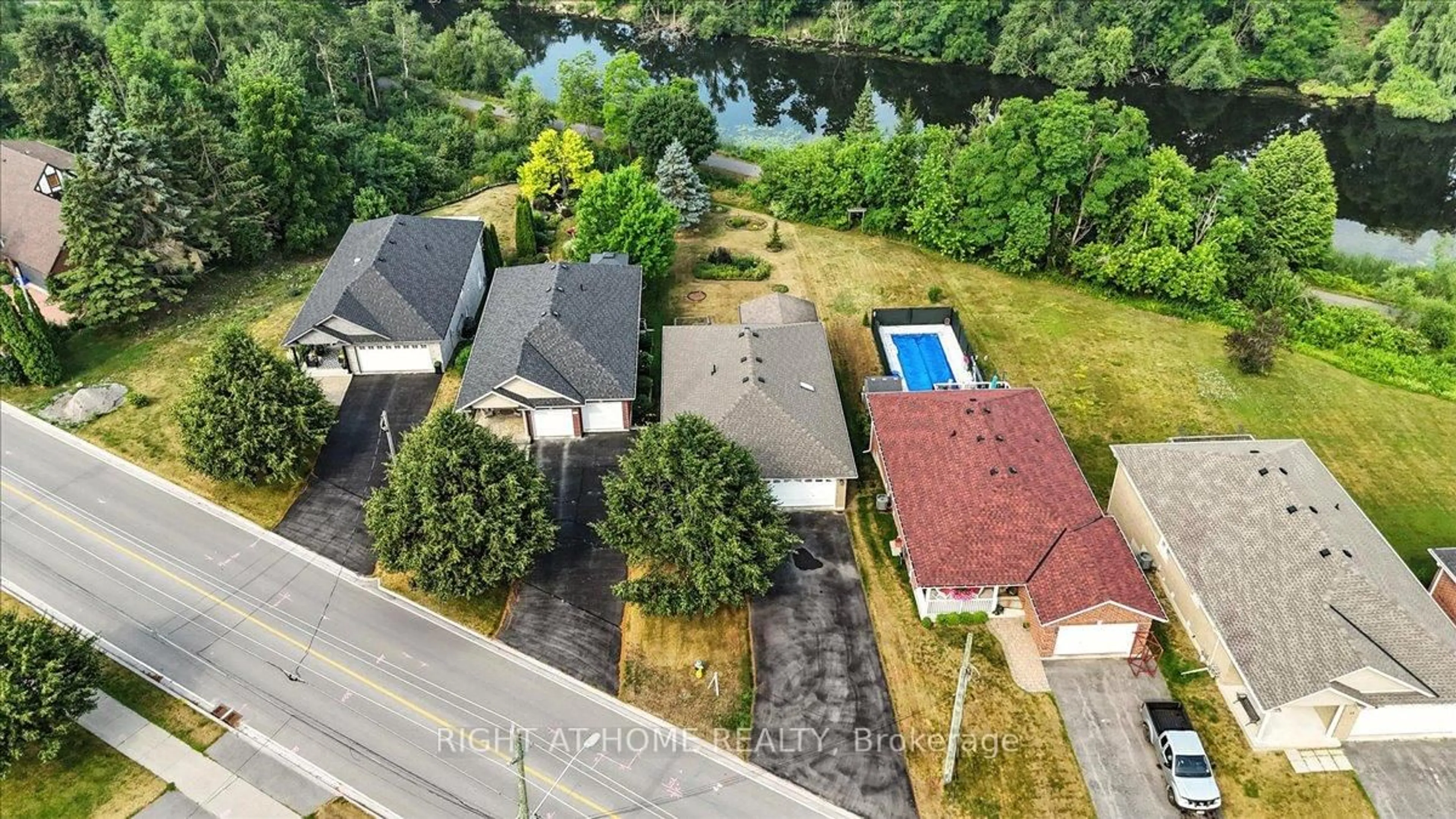 A pic from outside/outdoor area/front of a property/back of a property/a pic from drone, water/lake/river/ocean view for 47 Logie St, Kawartha Lakes Ontario K9V 1C3