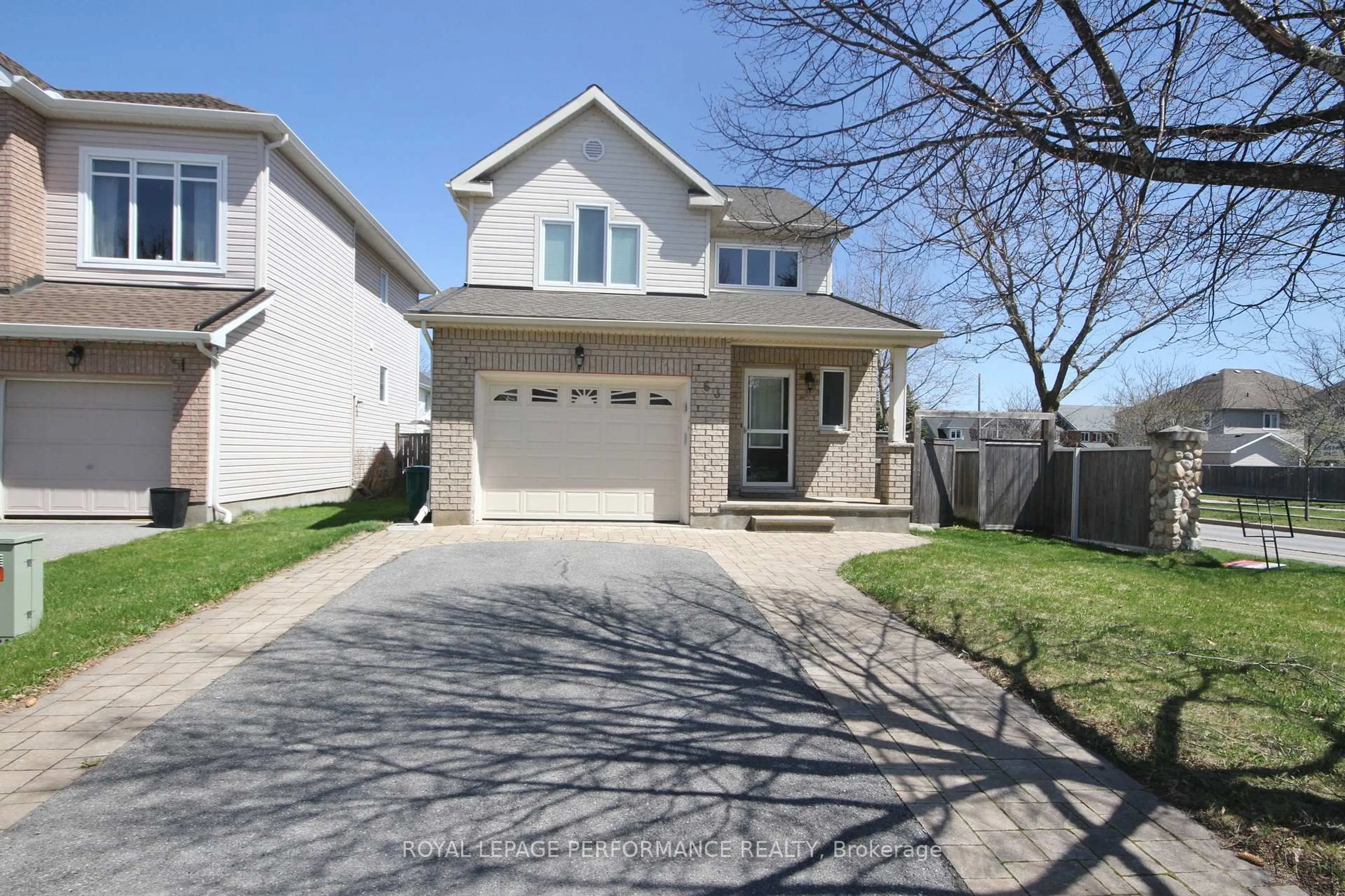 Home with vinyl exterior material, street for 63 Ambiance Dr, Ottawa Ontario K2G 6Y3