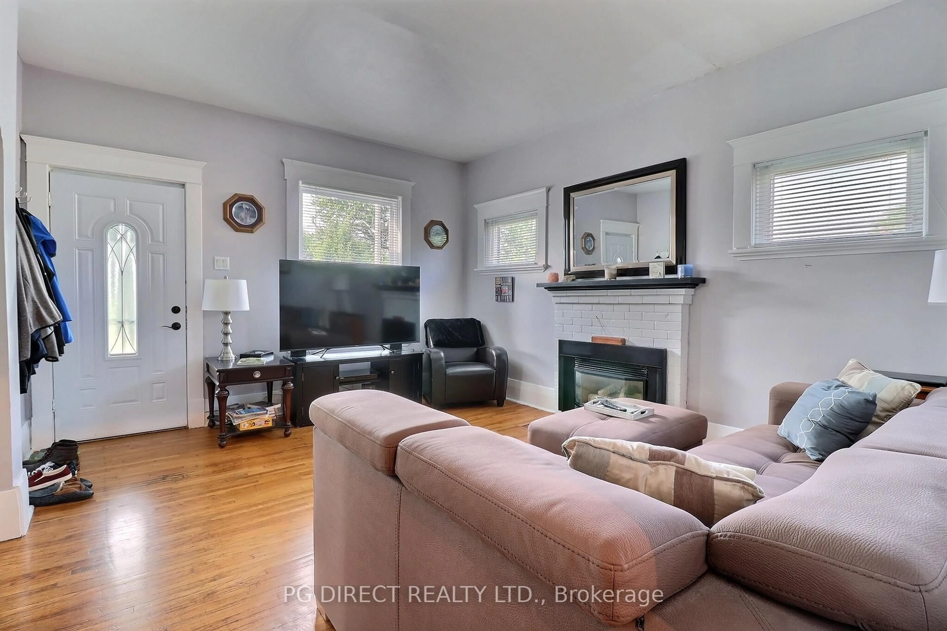Living room with furniture, wood/laminate floor for 7084 Longwoods Rd, London South Ontario N6P 1P9