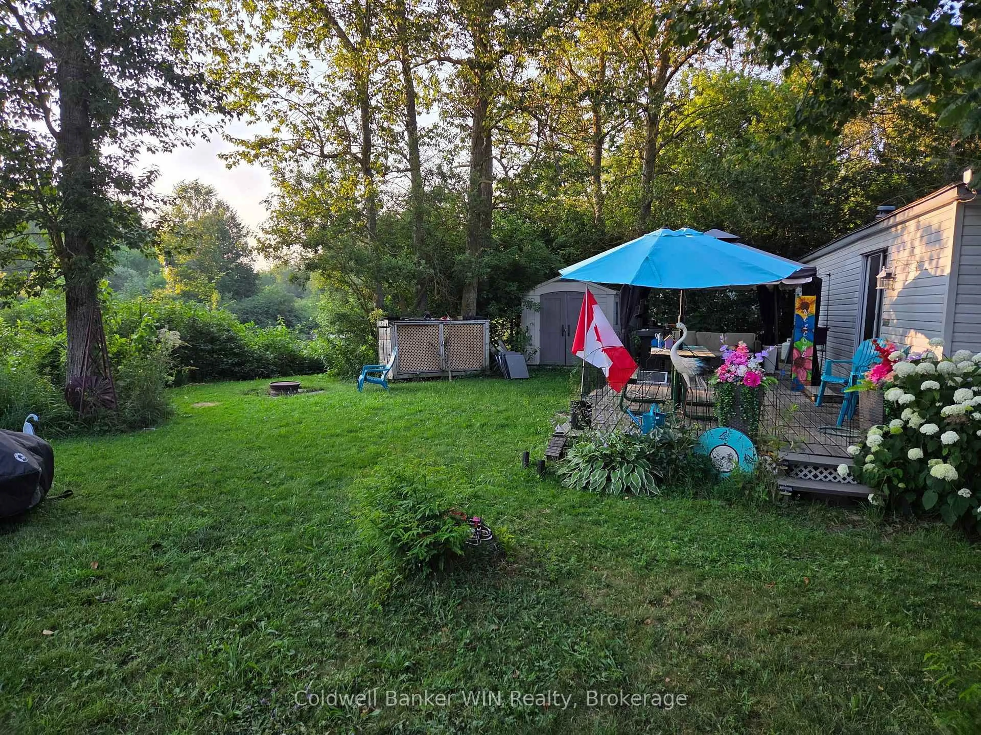 A pic from outside/outdoor area/front of a property/back of a property/a pic from drone, forest/trees view for 7489 SIDEROAD 5 E #E14 Edgewater, Wellington North Ontario N0G 2L0