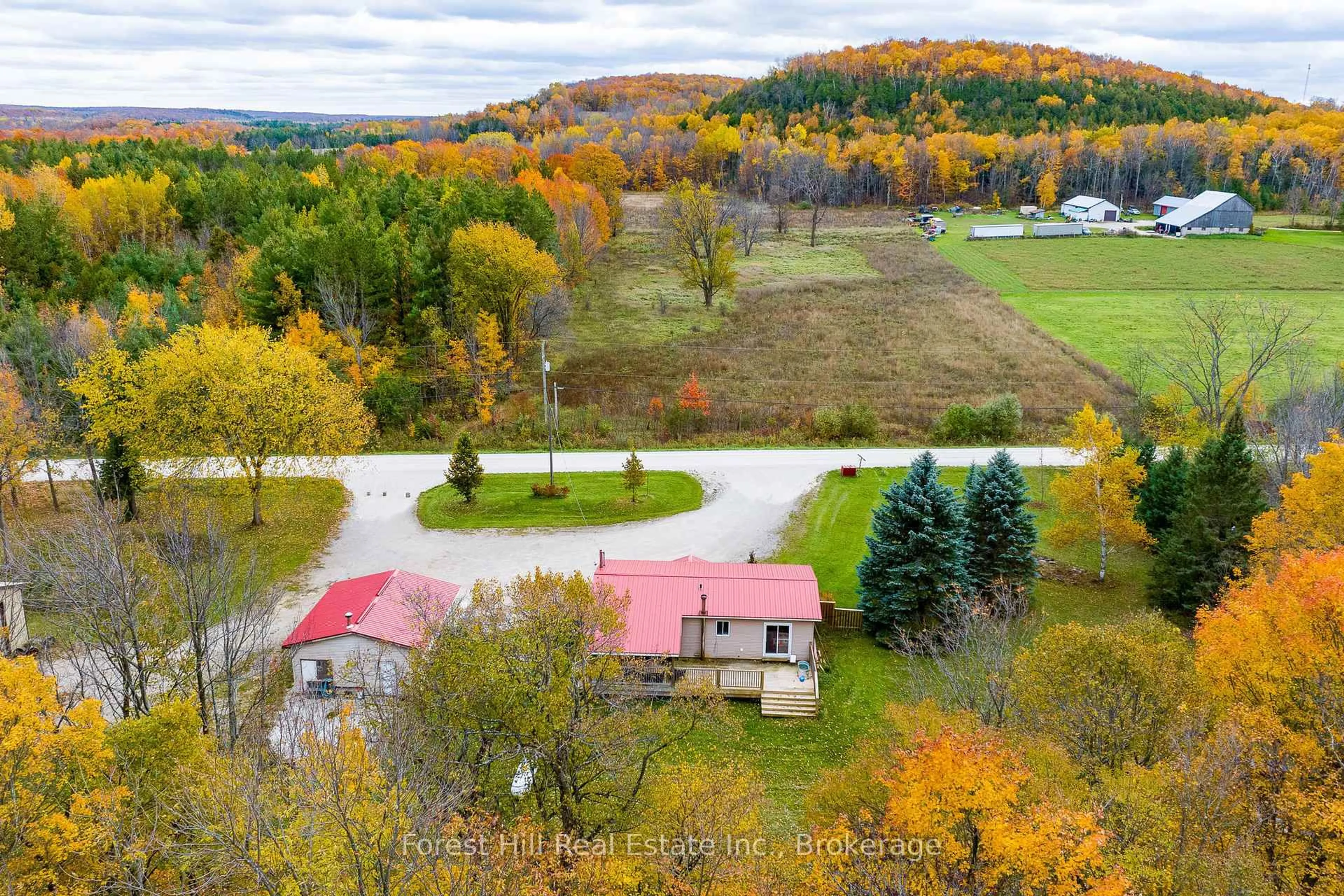 A pic from outside/outdoor area/front of a property/back of a property/a pic from drone, forest/trees view for 587317 9th Sdrd, Blue Mountains Ontario N0H 1J0