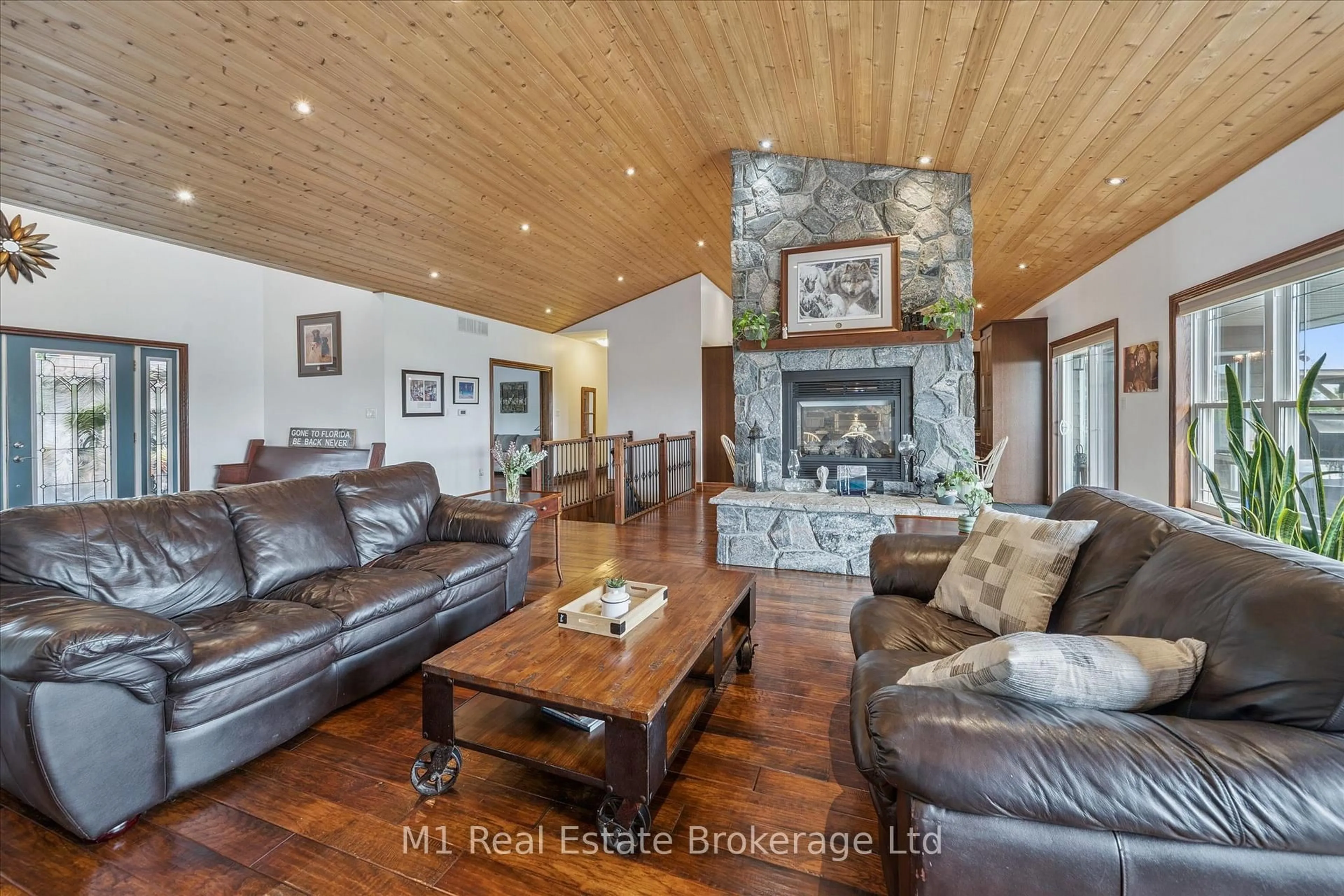 Living room with furniture, wood/laminate floor for 65 Big Sound Rd Rd, McDougall Ontario P0G 1G0
