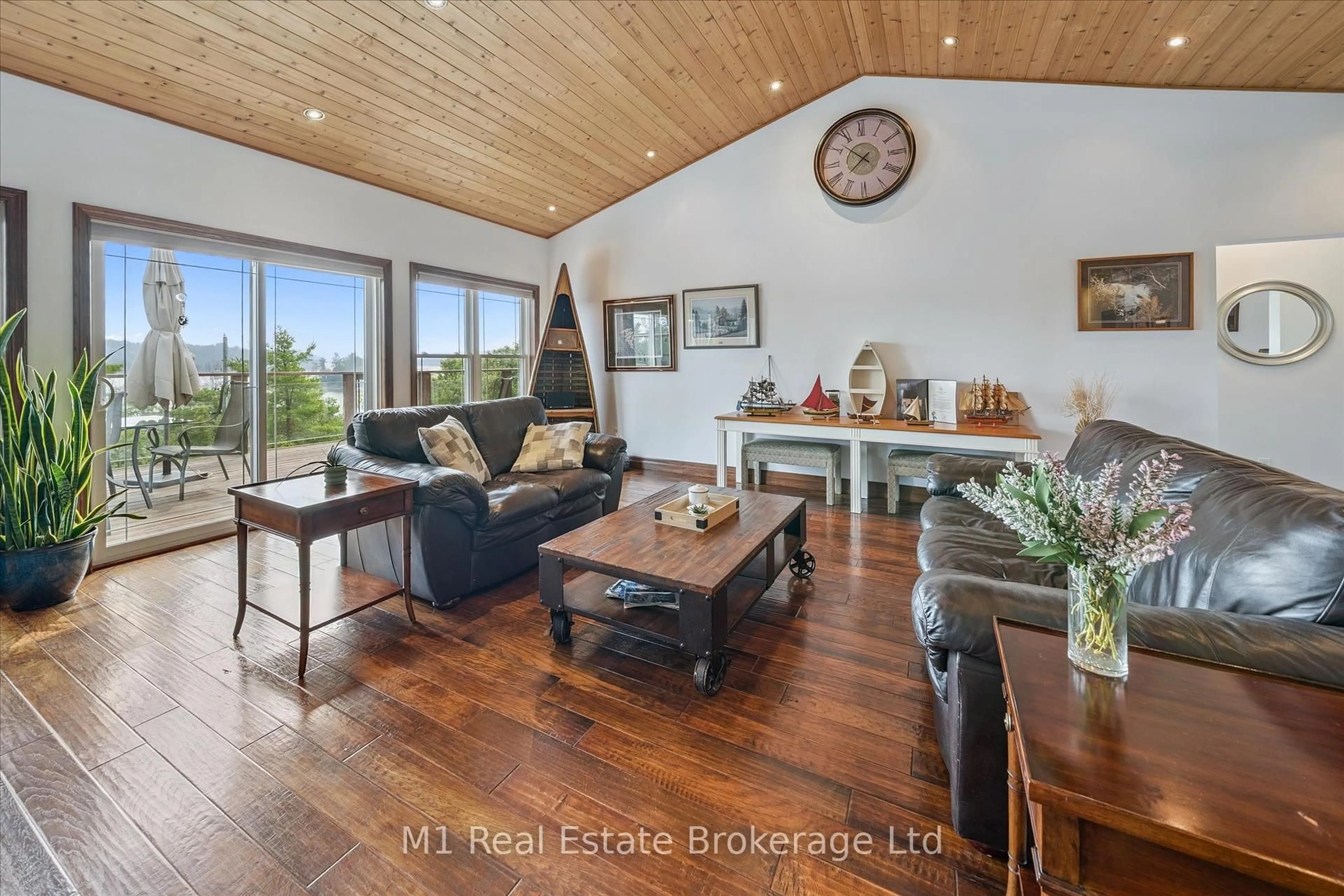 Living room with furniture, wood/laminate floor for 65 Big Sound Rd Rd, McDougall Ontario P0G 1G0