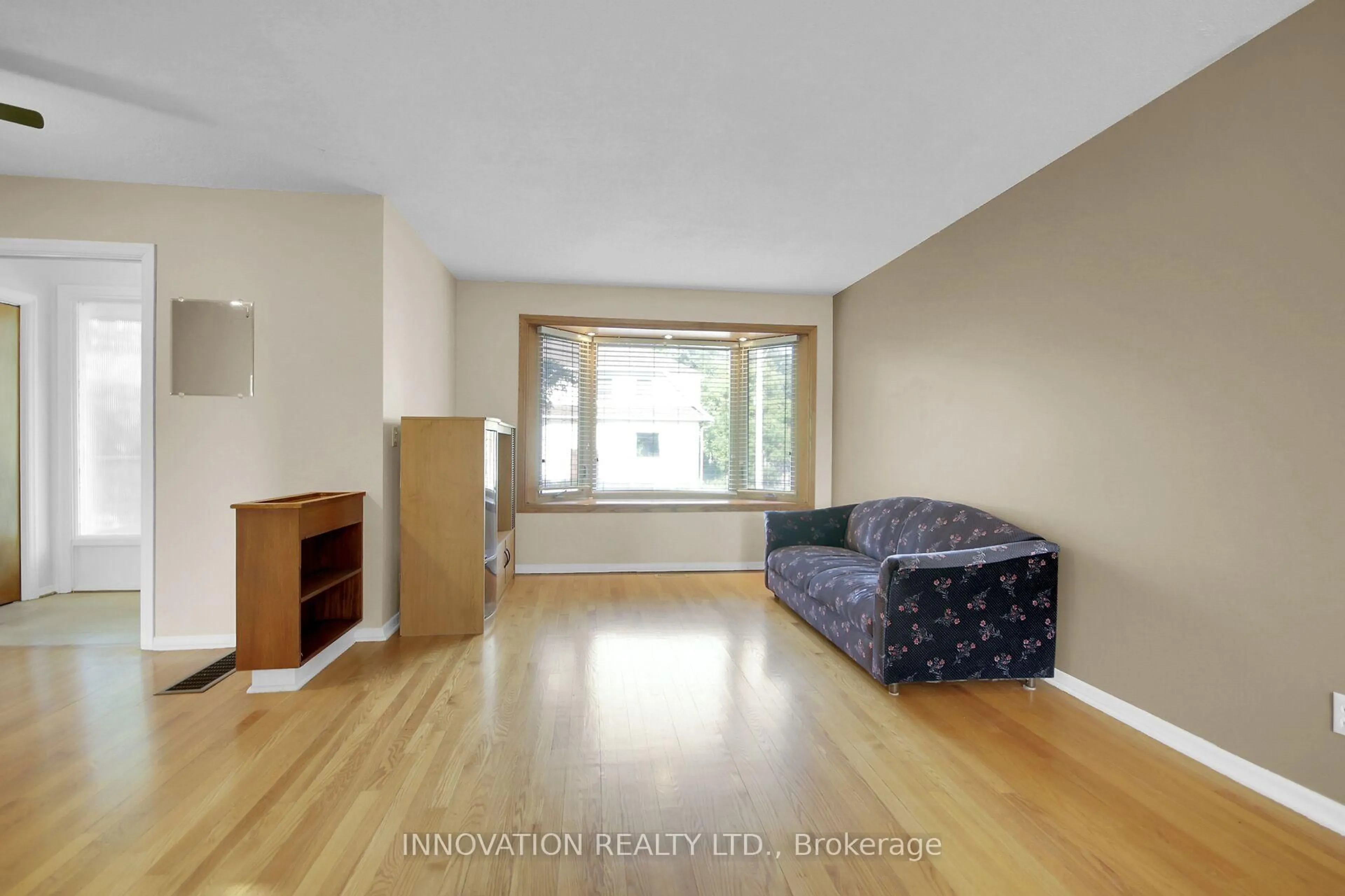 Living room with furniture, wood/laminate floor for 352 Britannia Rd, Ottawa Ontario K2B 5X8
