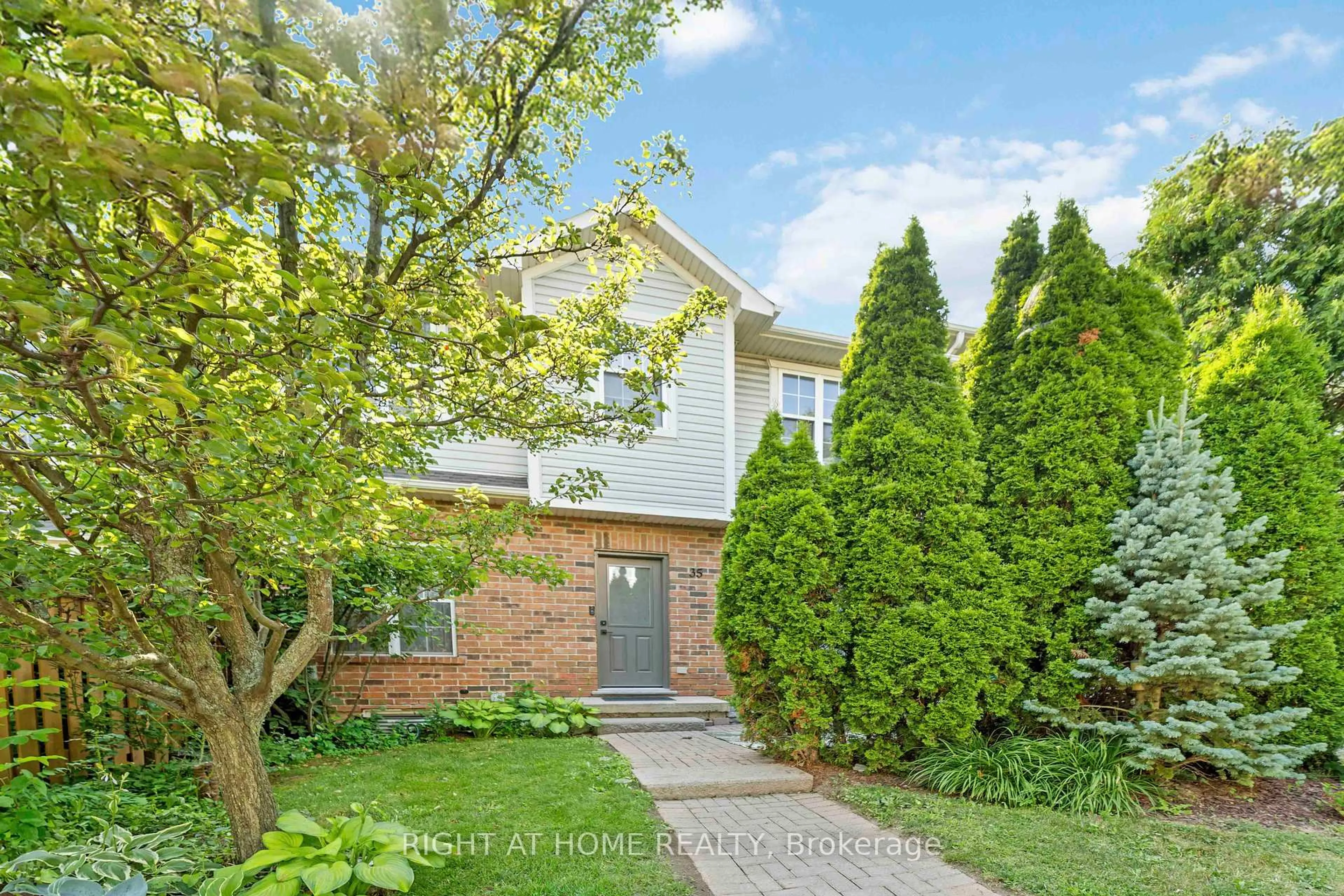 Home with brick exterior material, street for 1085 Harrogate Dr #35, Hamilton Ontario L9K 1R2