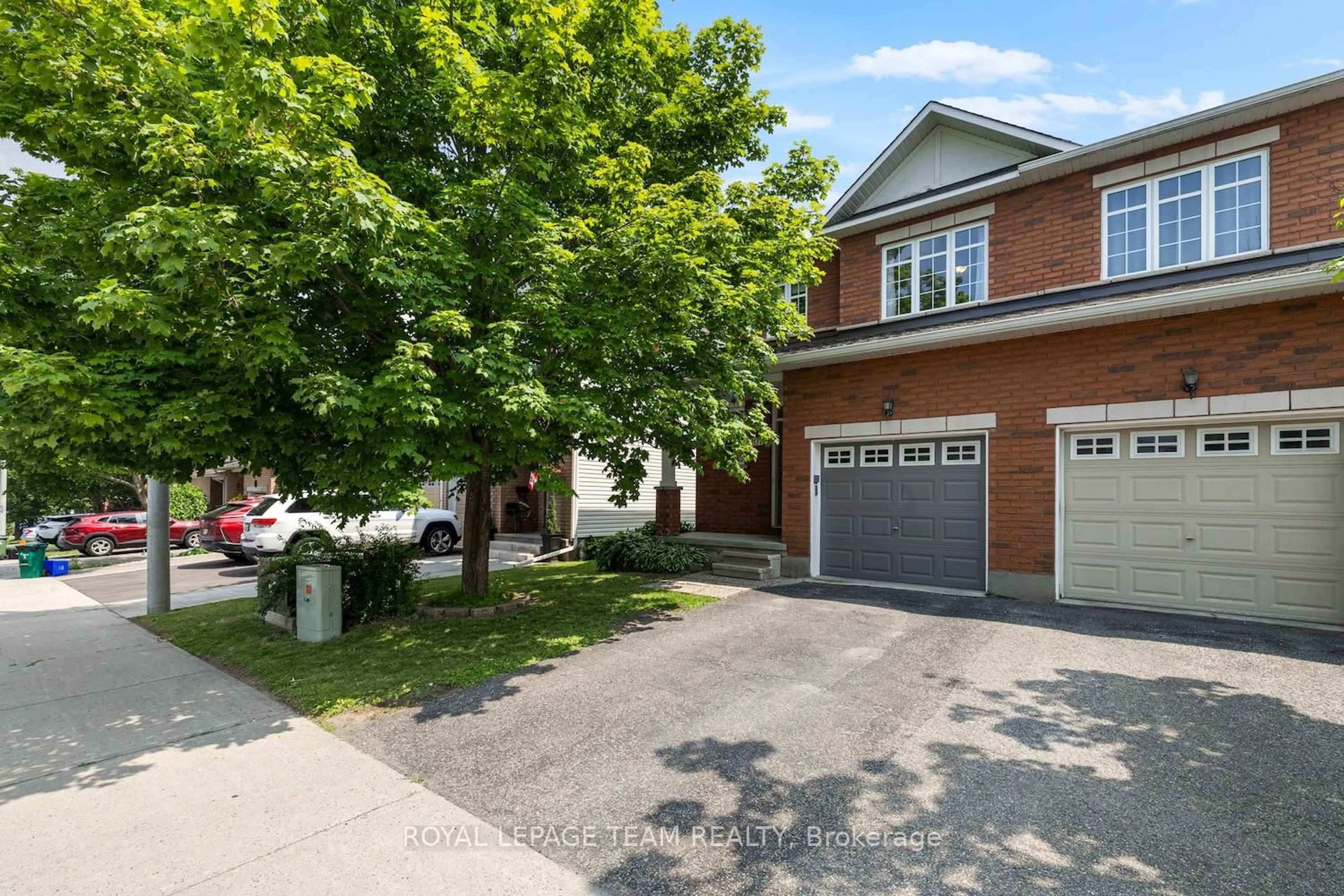 Home with brick exterior material, street for 207 Portrush Ave, Ottawa Ontario K2J 5J6