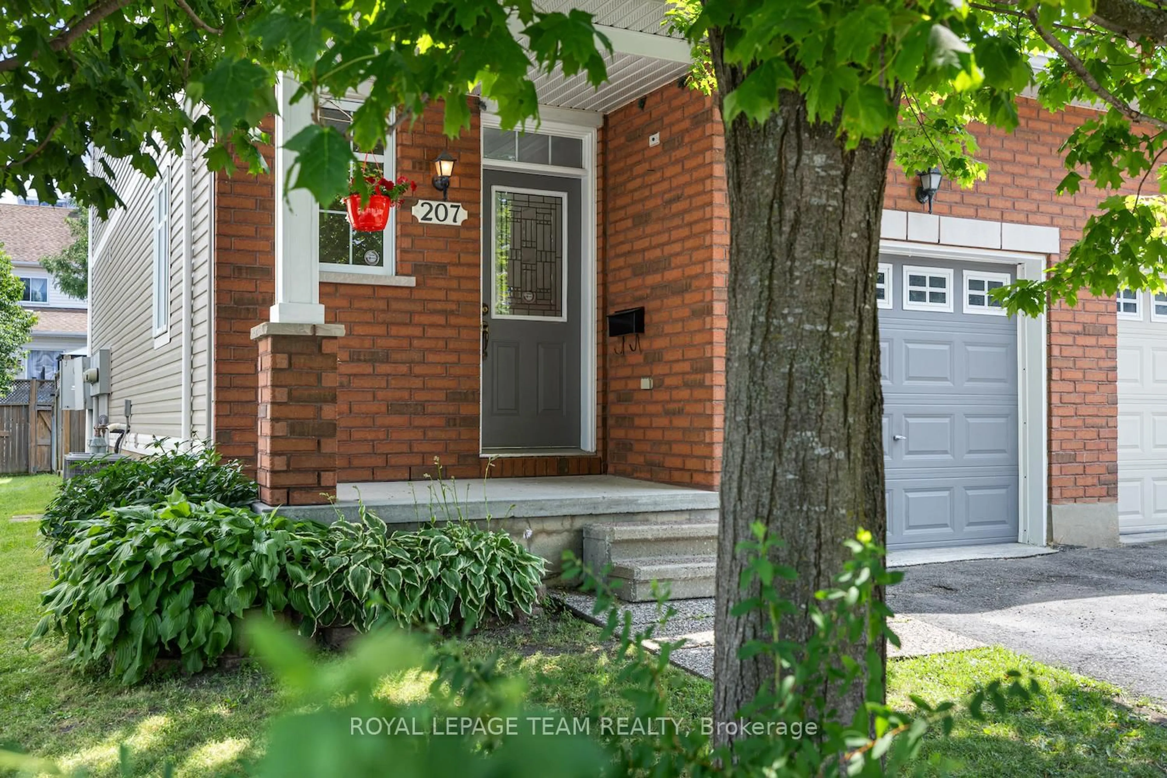 Home with brick exterior material, street for 207 Portrush Ave, Ottawa Ontario K2J 5J6