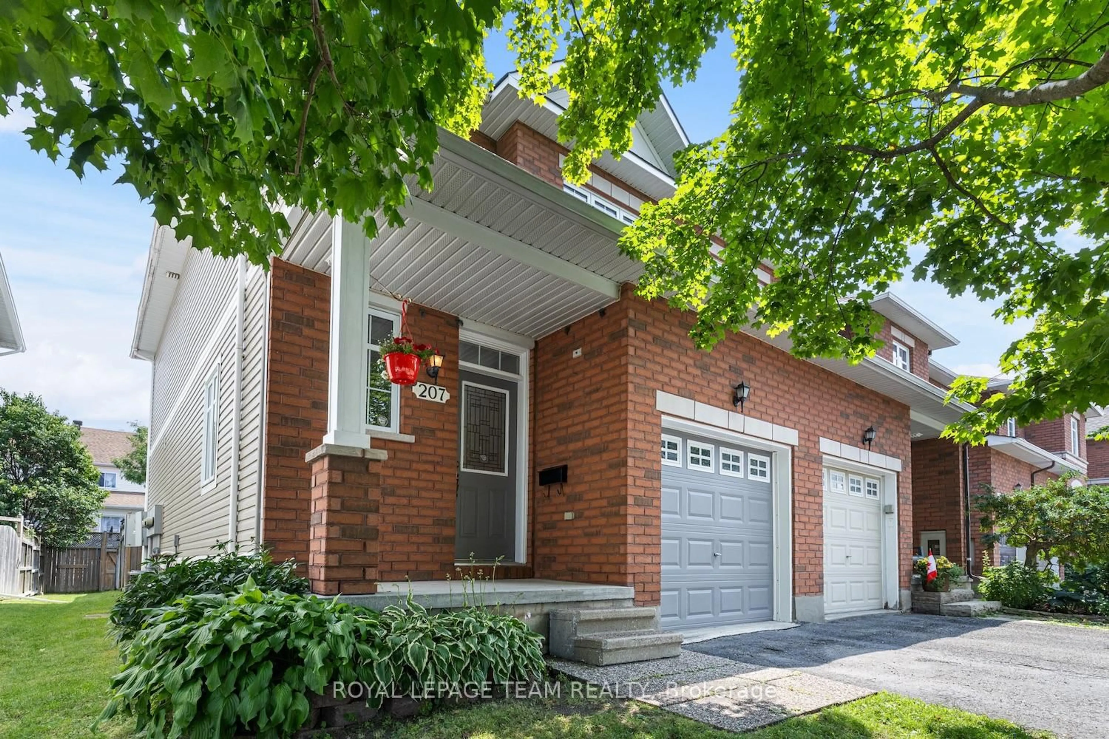 Home with brick exterior material, street for 207 Portrush Ave, Ottawa Ontario K2J 5J6