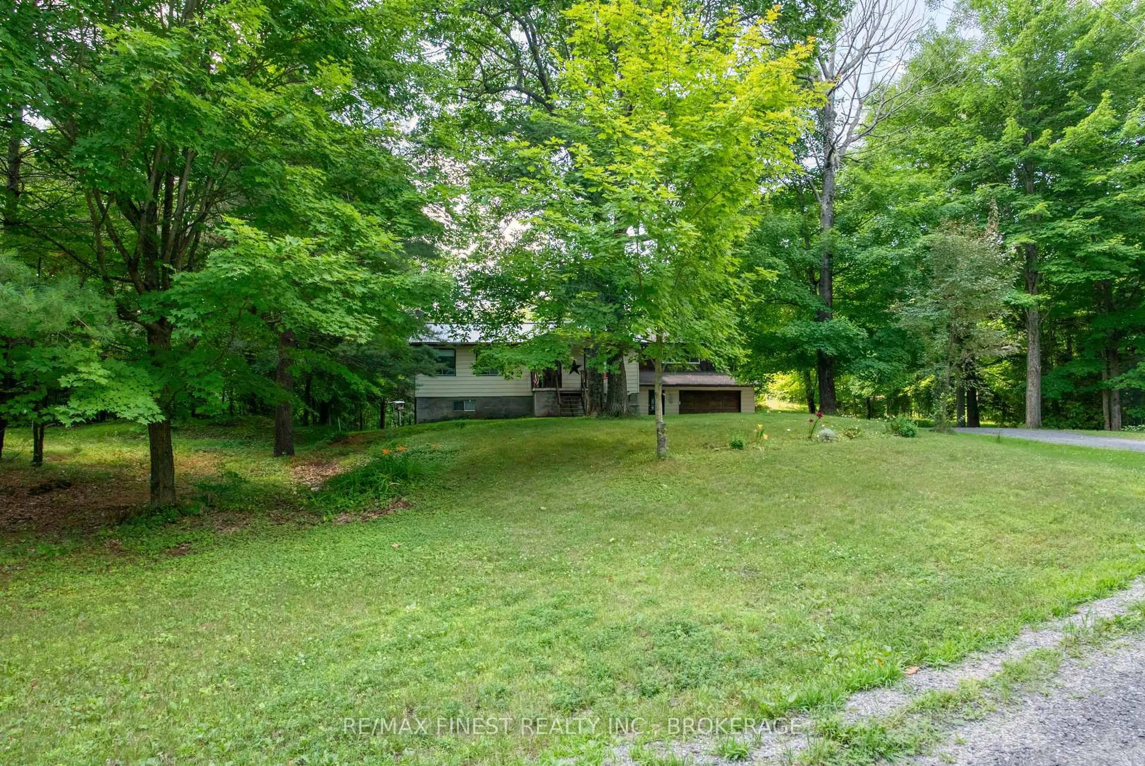 A pic from outside/outdoor area/front of a property/back of a property/a pic from drone, forest/trees view for 90 Bradshaw Rd, Tichborne Ontario K0H 2V0