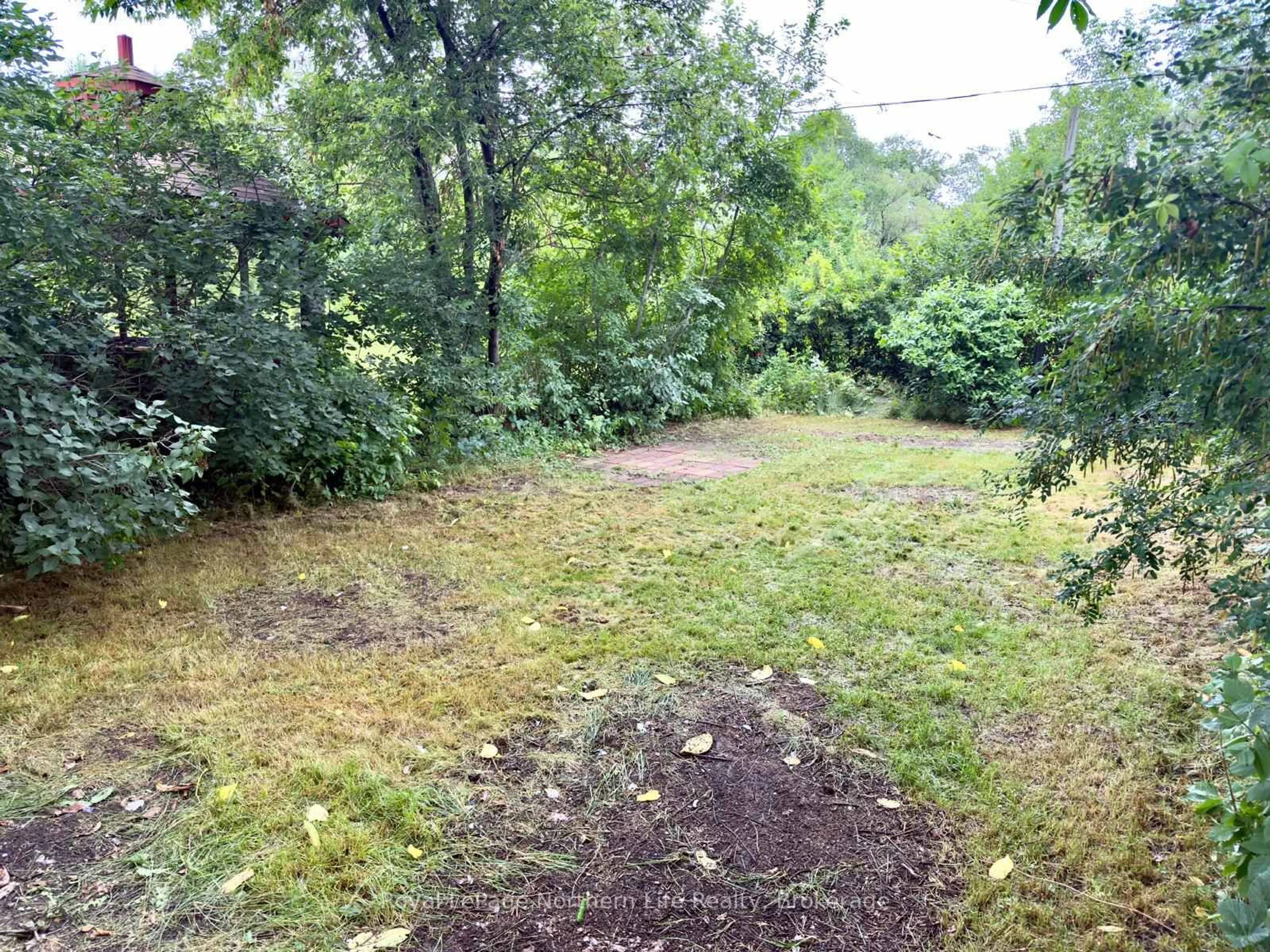 A pic from outside/outdoor area/front of a property/back of a property/a pic from drone, forest/trees view for 638 Second Ave, North Bay Ontario P1B 1M2