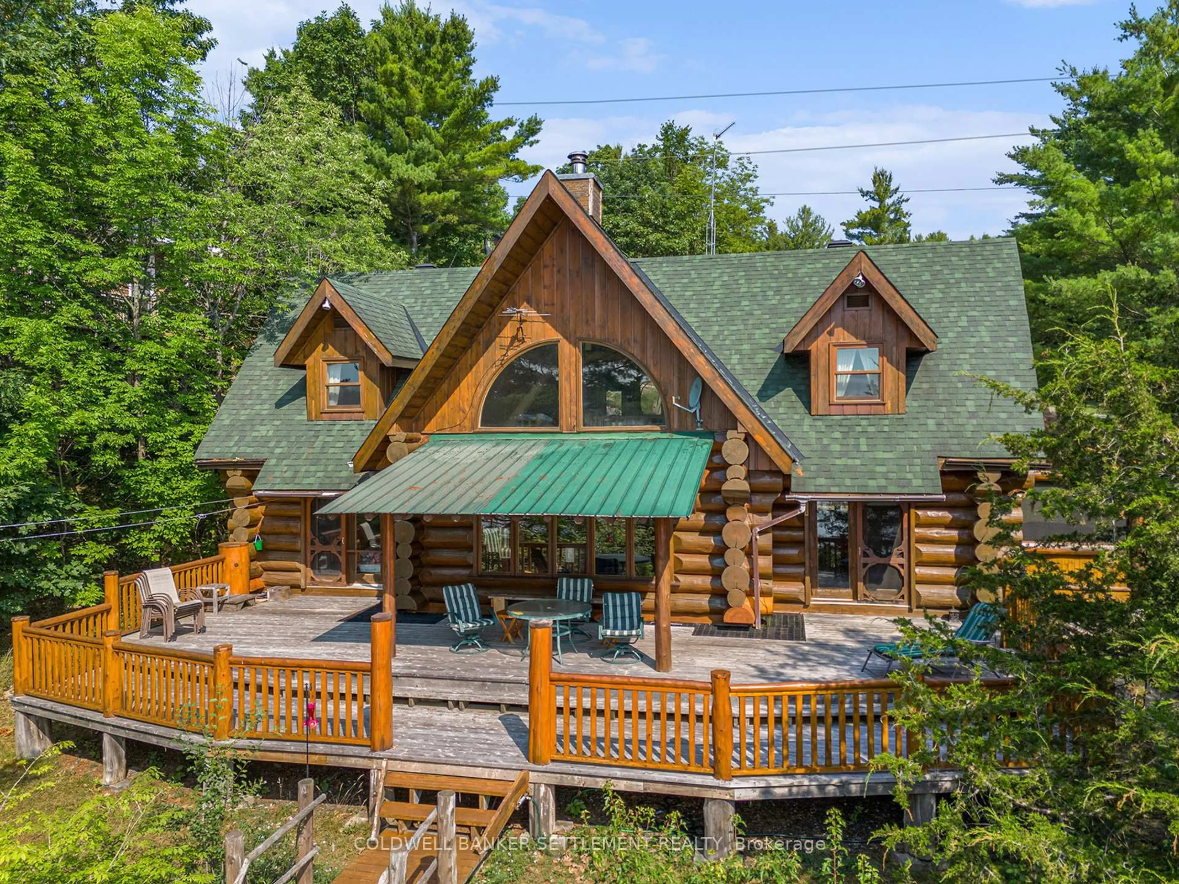A pic from outside/outdoor area/front of a property/back of a property/a pic from drone, unknown for 781 Big Rideau N/shore Rd, Perth Ontario K7H 3C5