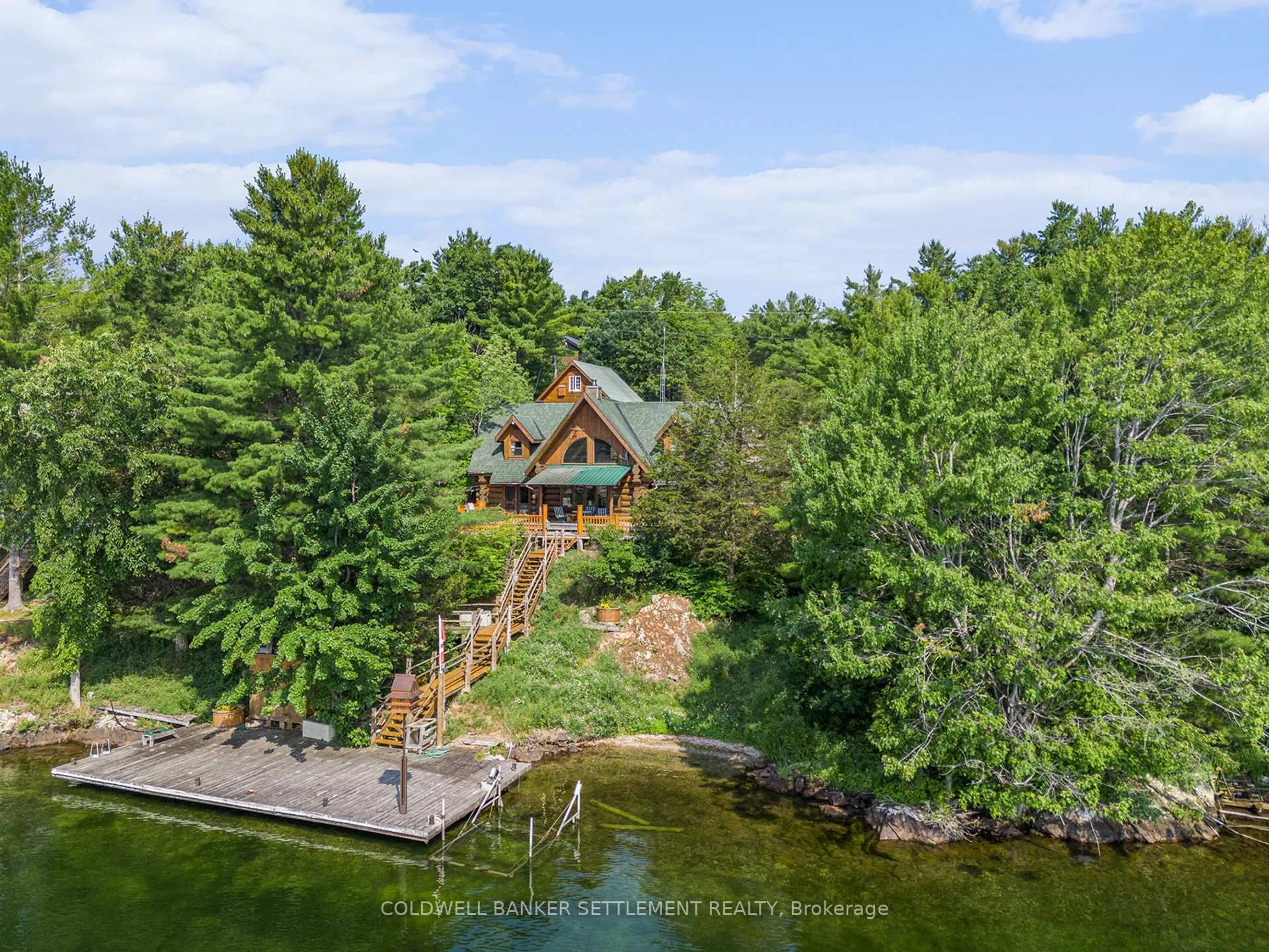 A pic from outside/outdoor area/front of a property/back of a property/a pic from drone, water/lake/river/ocean view for 781 Big Rideau N/shore Rd, Perth Ontario K7H 3C5