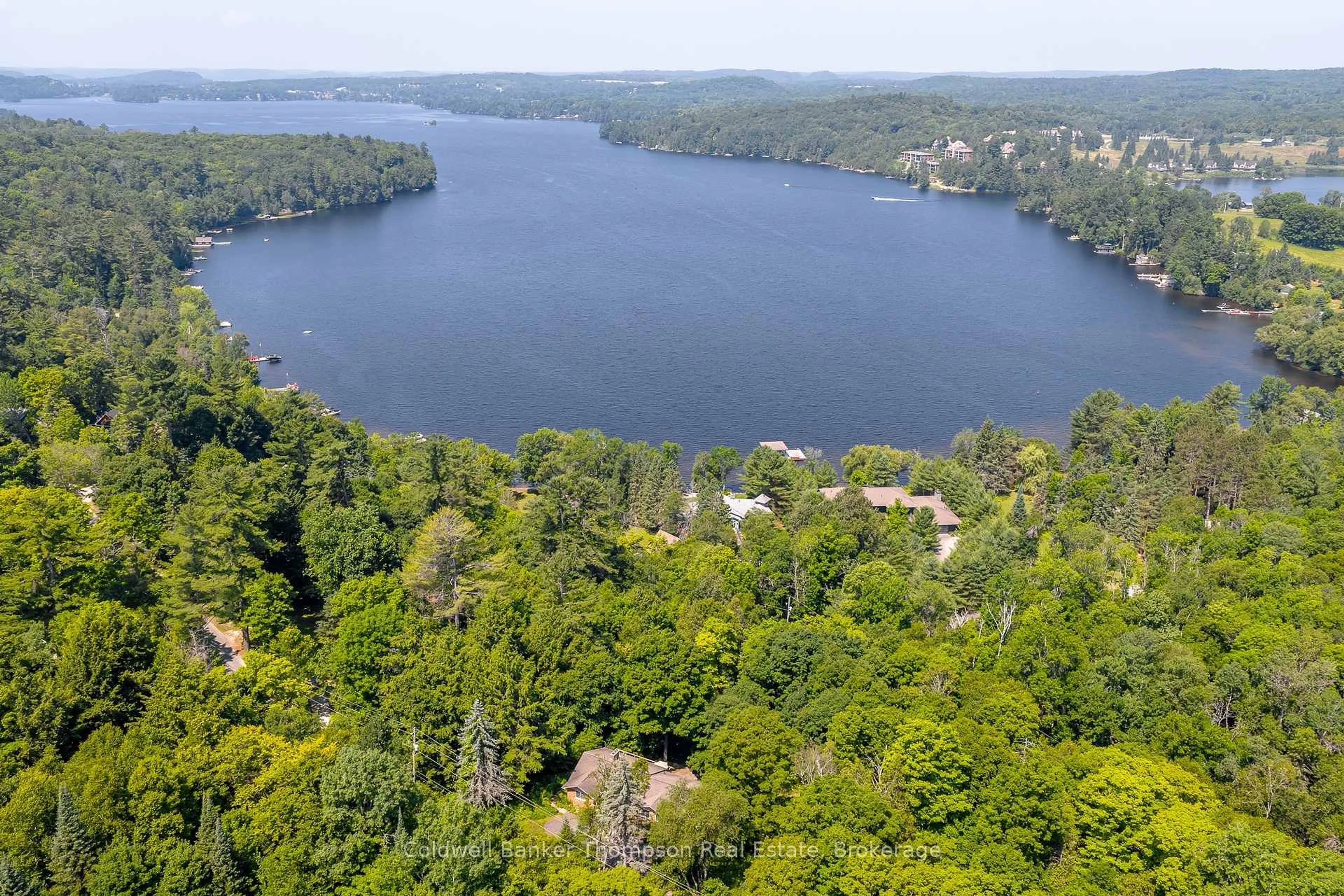 A pic from outside/outdoor area/front of a property/back of a property/a pic from drone, water/lake/river/ocean view for 224 Swallowdale Rd, Huntsville Ontario P1H 0A5