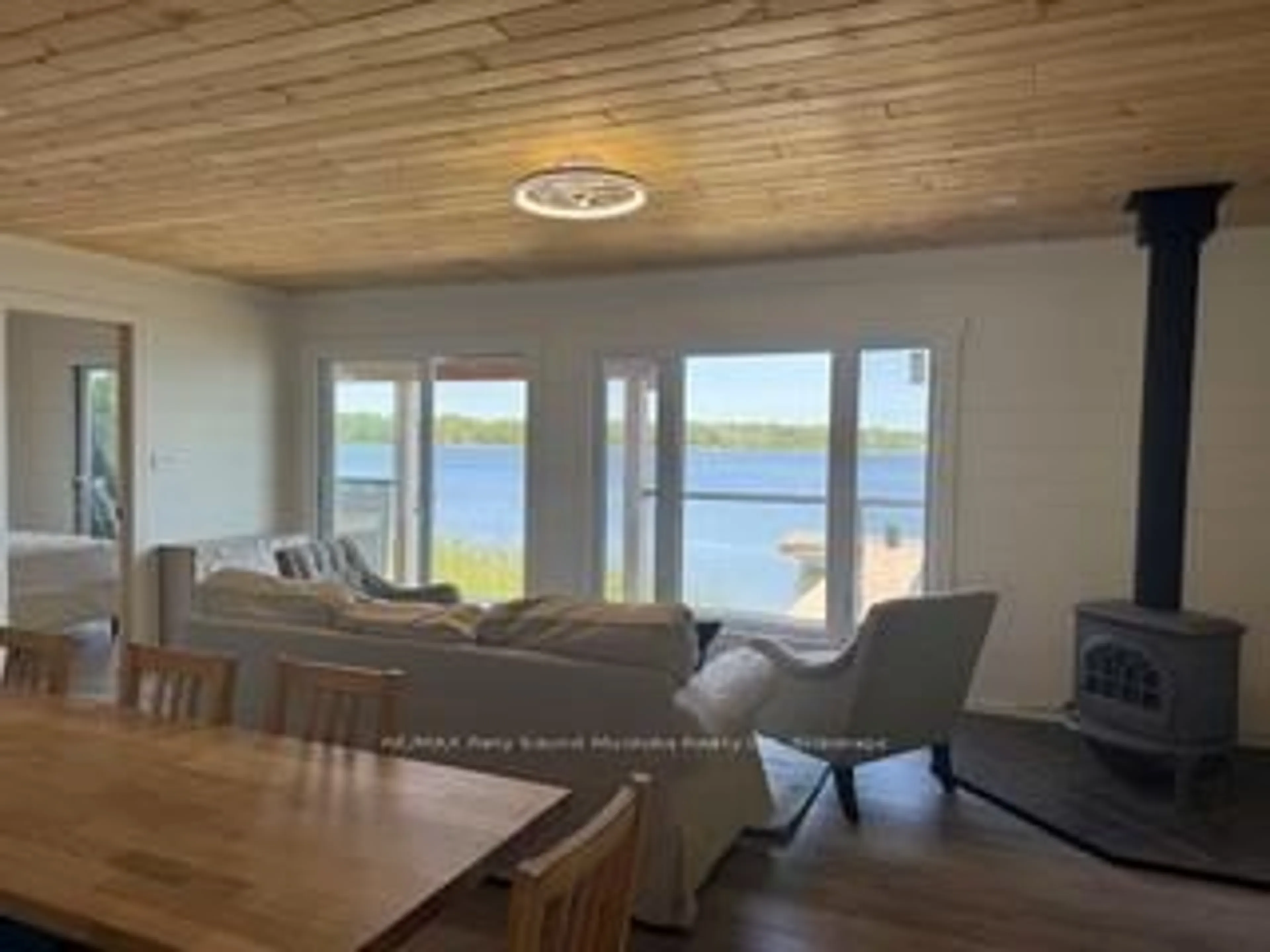 Living room with furniture, unknown for 1370 Georgian Bay Water, The Archipelago Ontario P0G 1K0