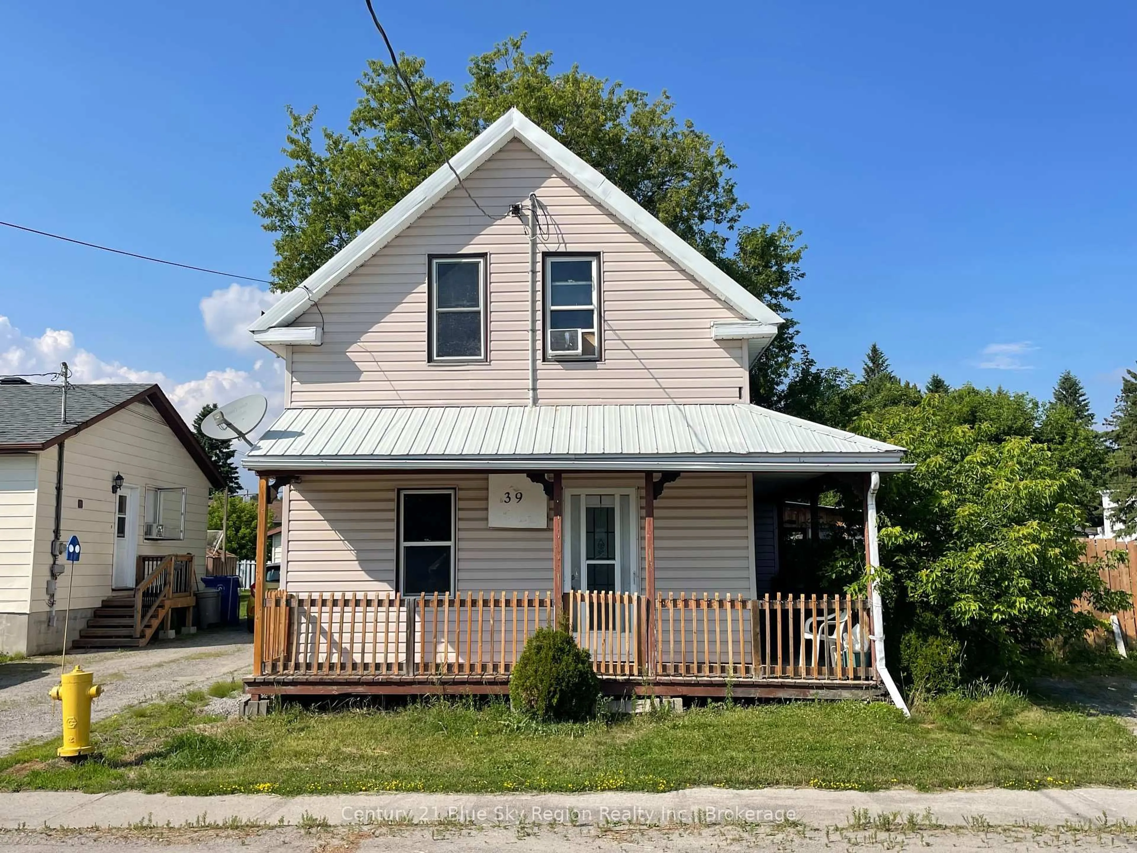 Home with vinyl exterior material, street for 39 Principale St, West Nipissing Ontario P0H 2M0
