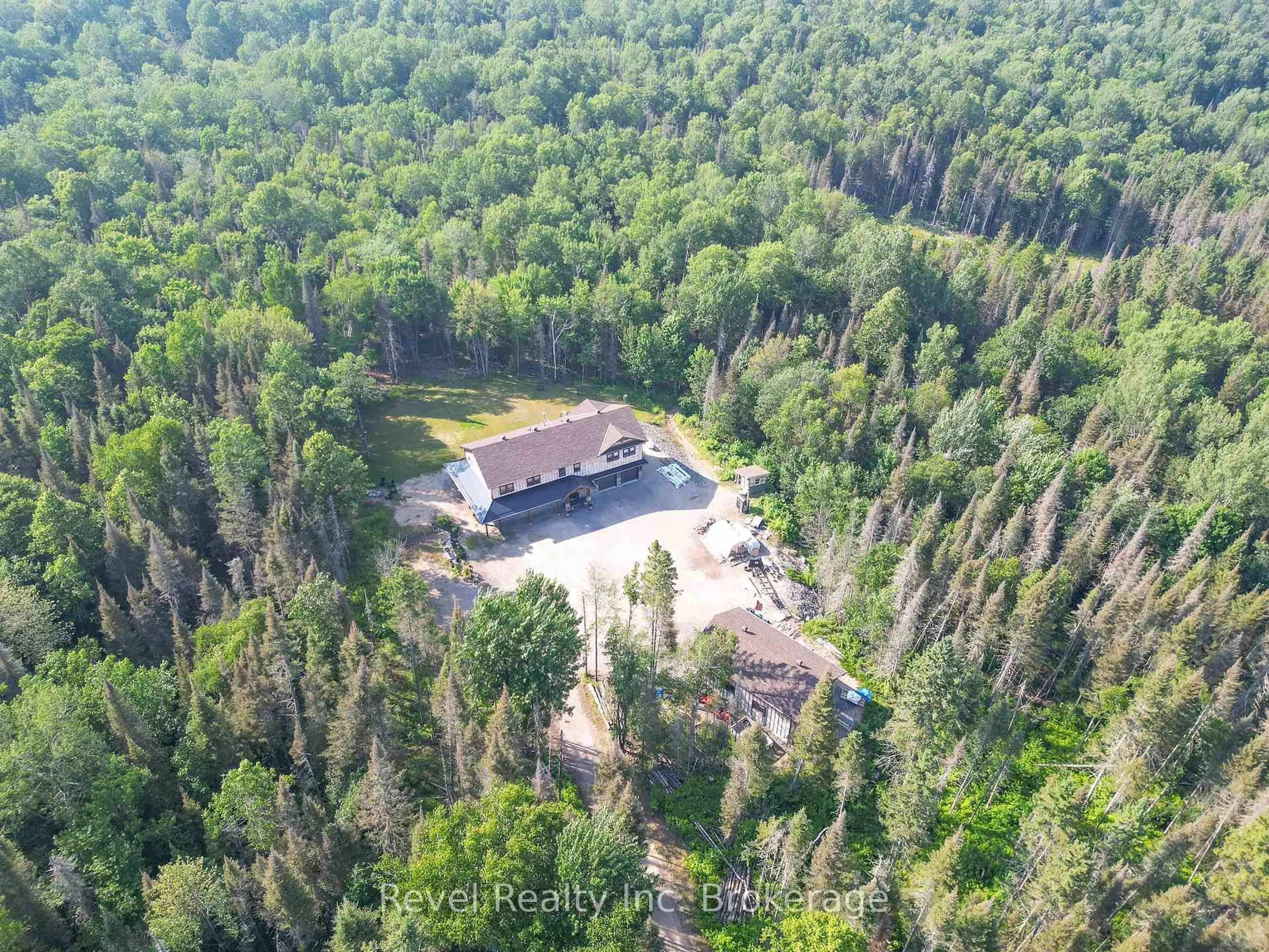 A pic from outside/outdoor area/front of a property/back of a property/a pic from drone, forest/trees view for 1196 River Rd, Chisholm Ontario P0H 1B0