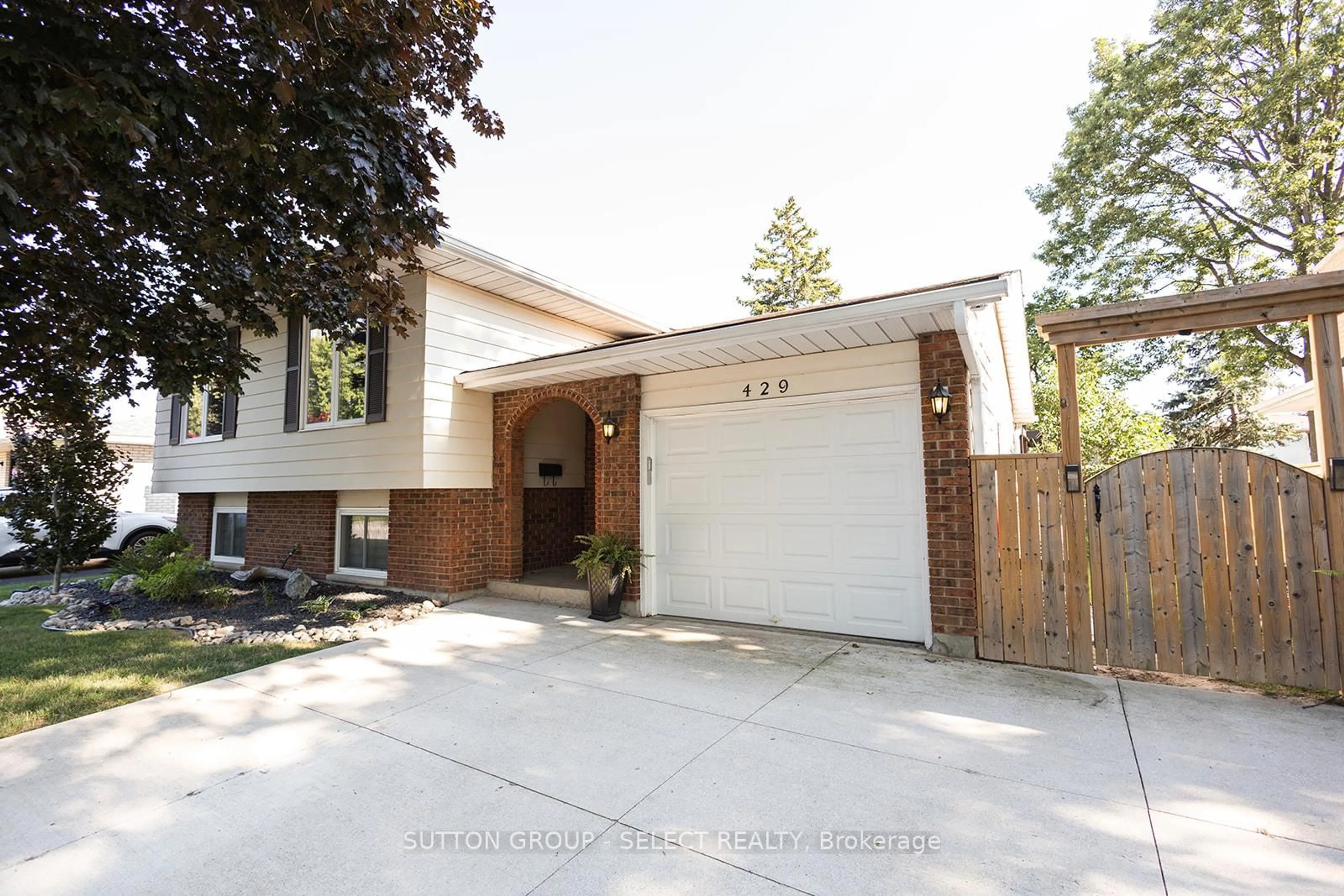 Home with brick exterior material, street for 429 Treewood Cres, Sarnia Ontario N7S 5B2