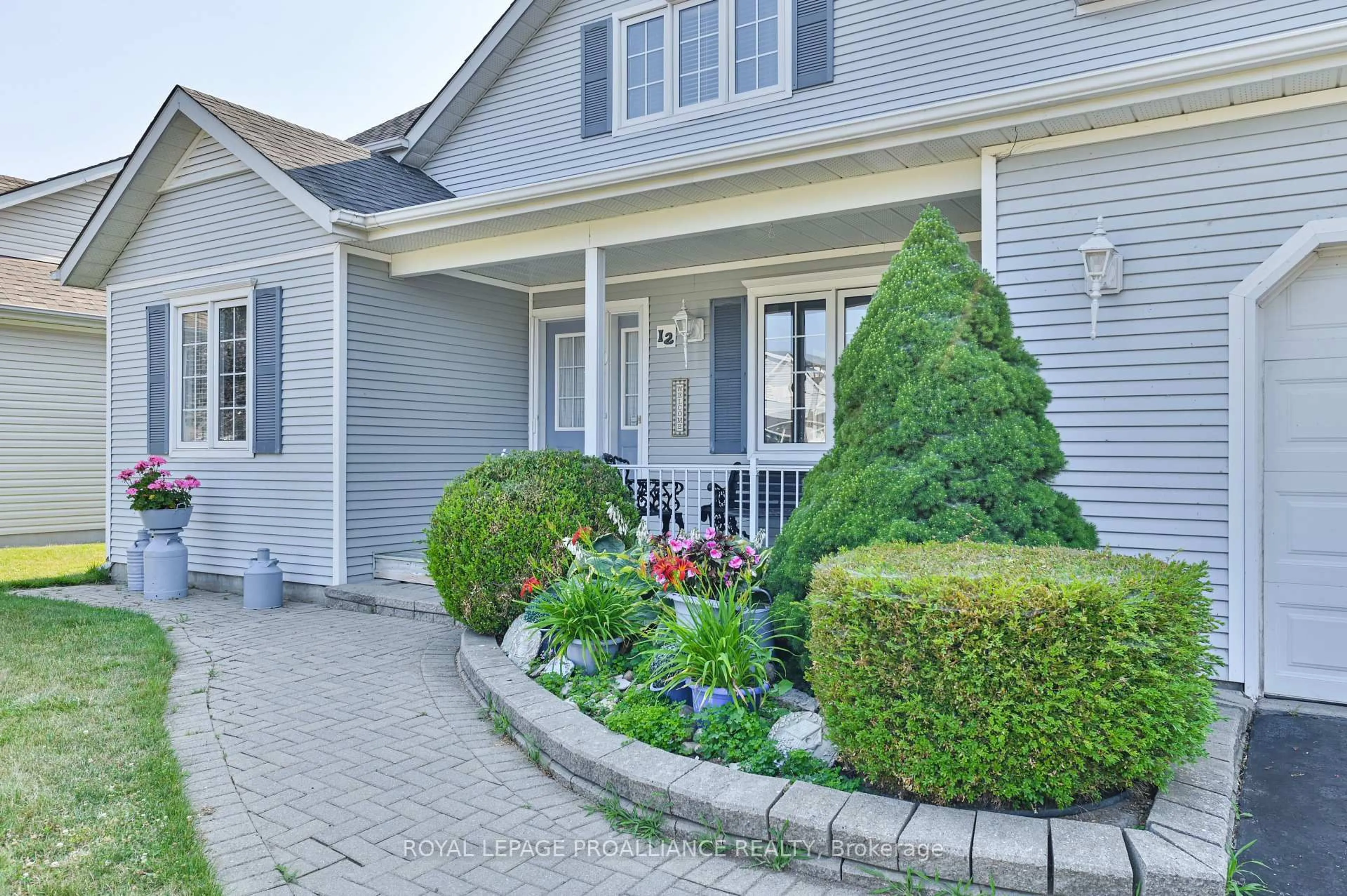 Home with vinyl exterior material, street for 12 Nesbitt Dr, Brighton Ontario K0K 1H0