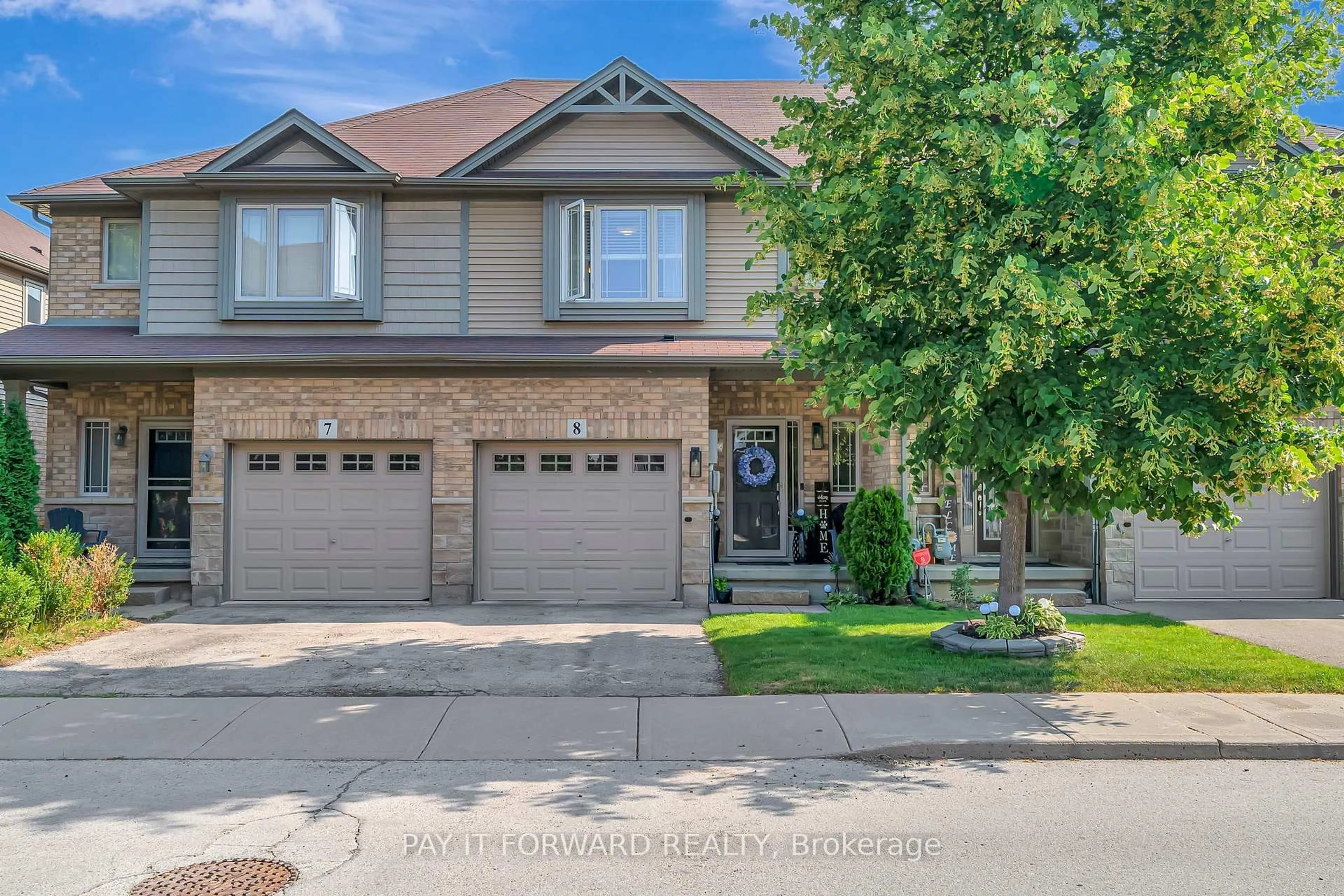 Home with brick exterior material, street for 310 Fall Fair Way #8, Hamilton Ontario L0R 1C0