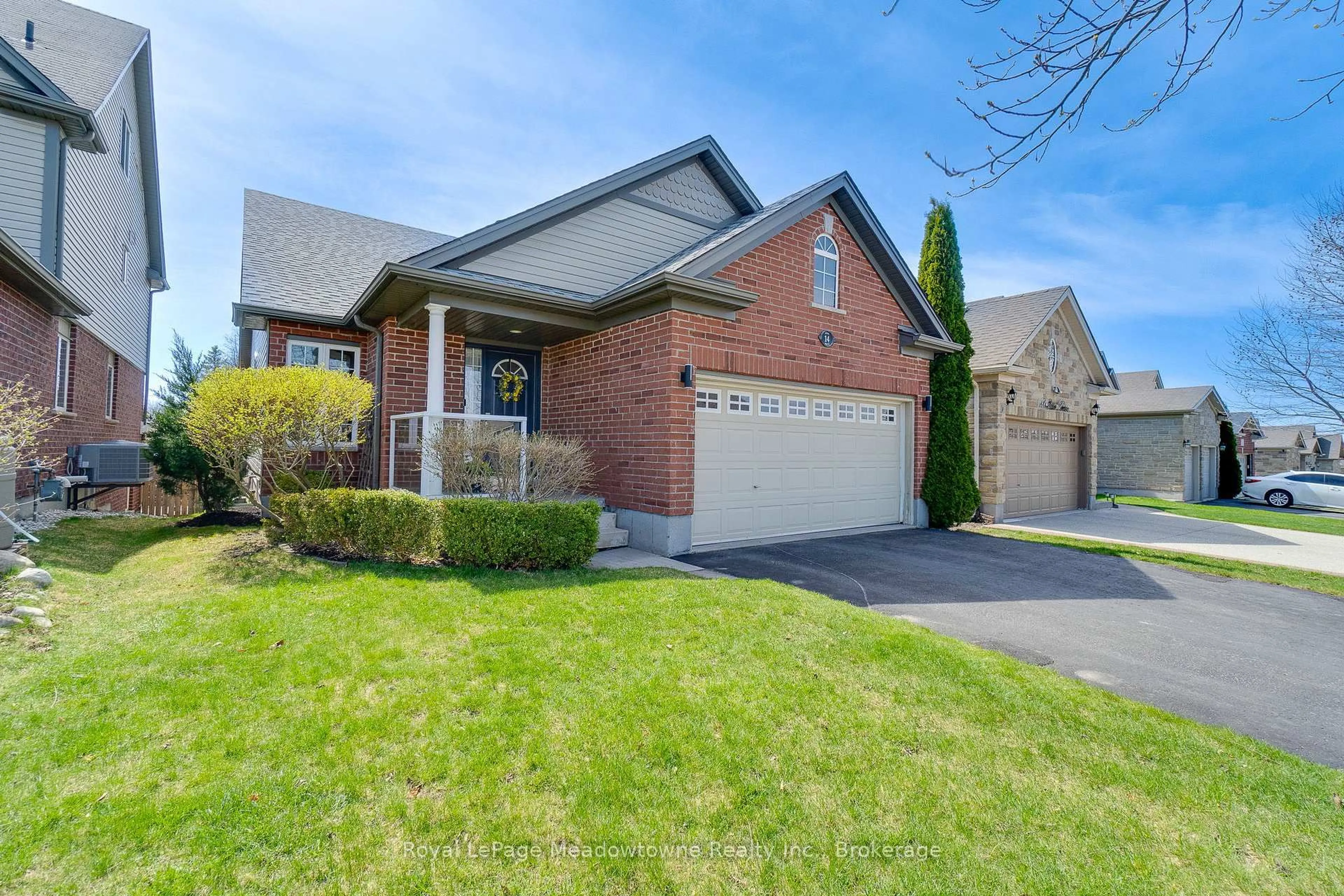 Home with brick exterior material, street for 14 Atto Dr, Guelph Ontario N1E 0E4