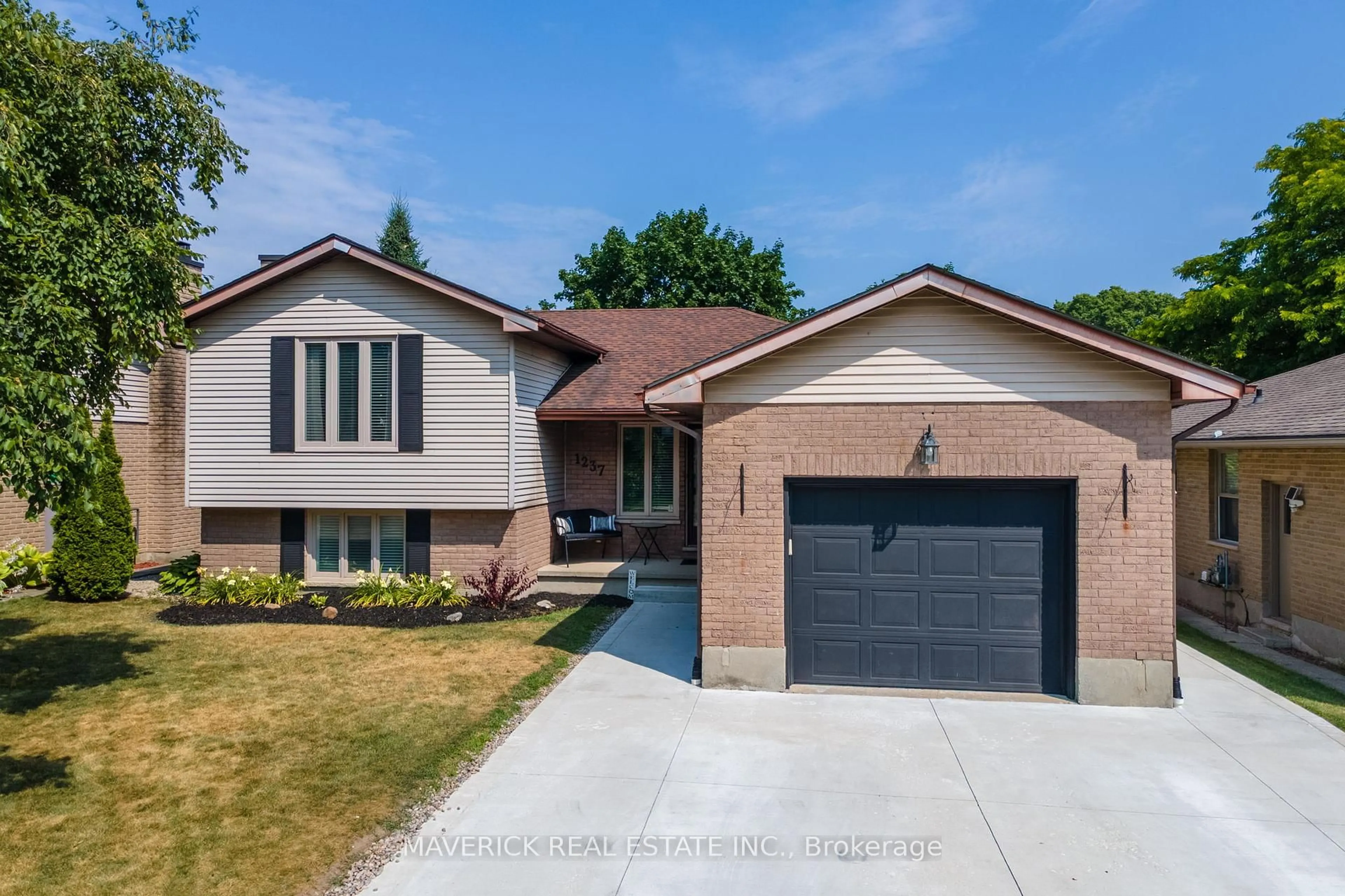 Home with brick exterior material, street for 1237 Glenora Dr, London North Ontario N5X 2P6