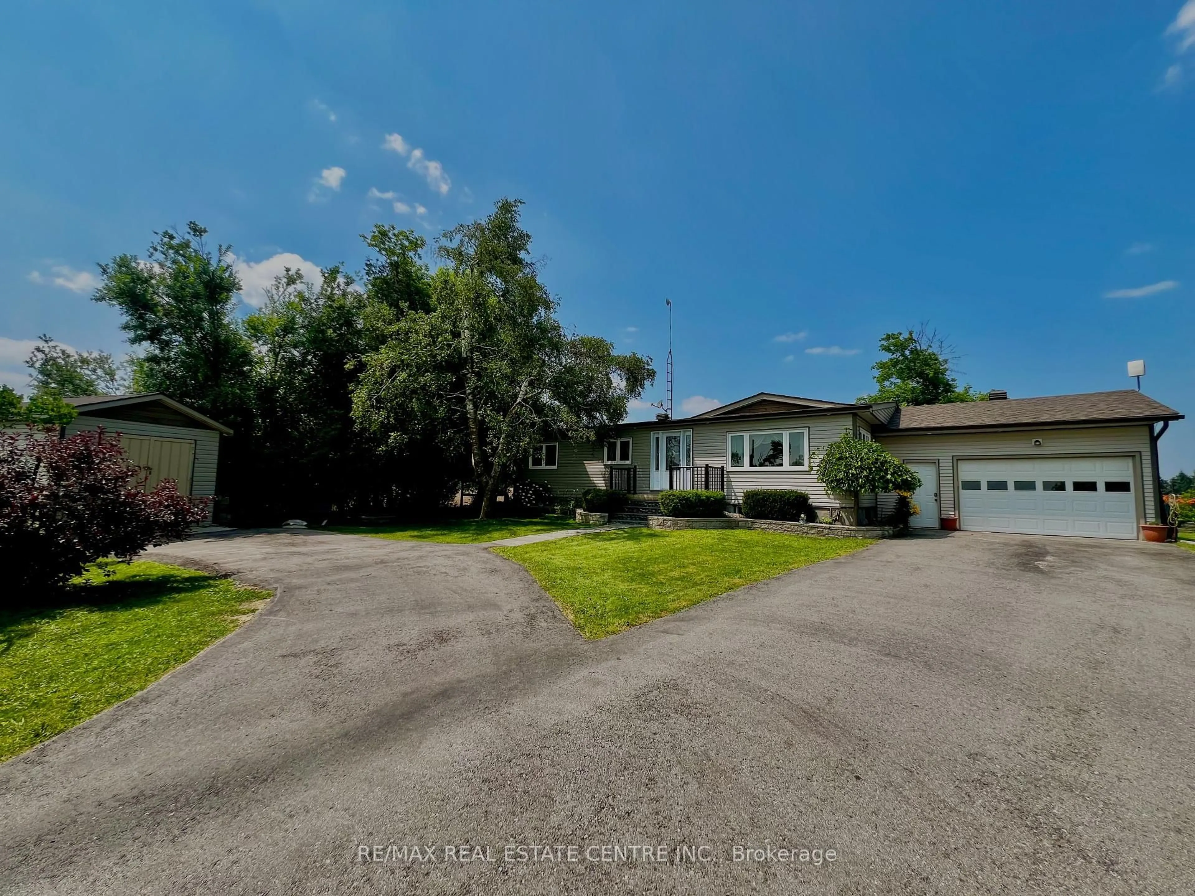 A pic from outside/outdoor area/front of a property/back of a property/a pic from drone, street for 705409 County Rd 21 Rd, Melancthon Ontario L9V 2A3