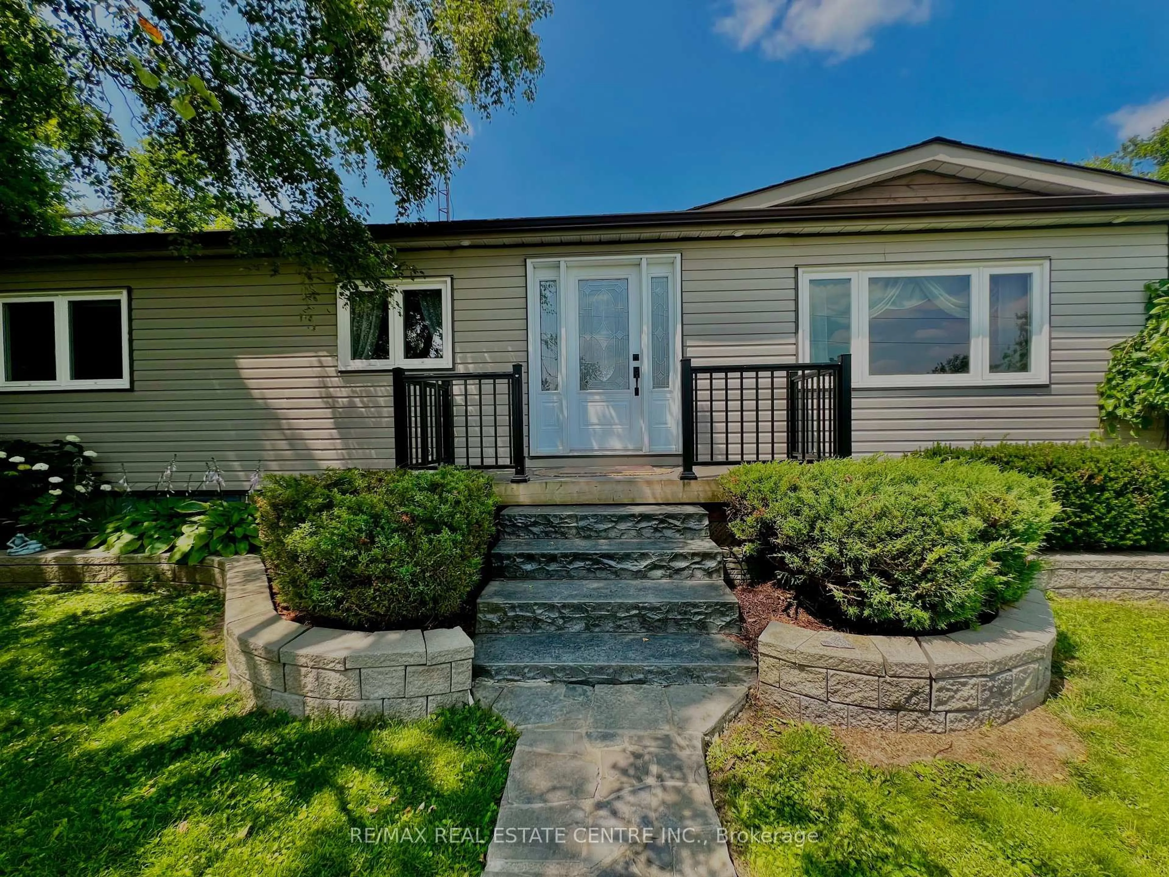 Home with vinyl exterior material, street for 705409 County Rd 21 Rd, Melancthon Ontario L9V 2A3