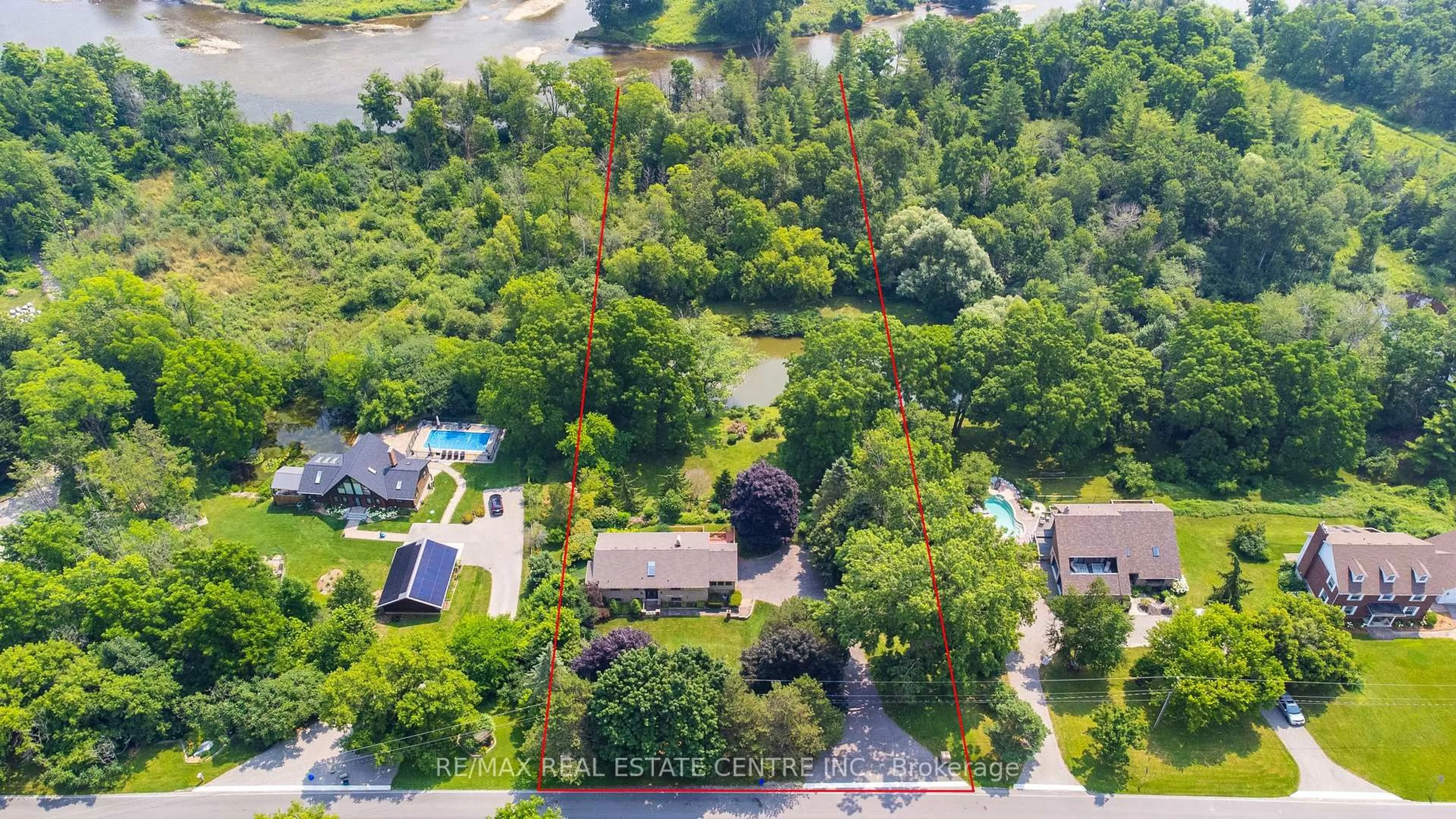 A pic from outside/outdoor area/front of a property/back of a property/a pic from drone, forest/trees view for 1023 West River Rd, Cambridge Ontario N1R 5S5