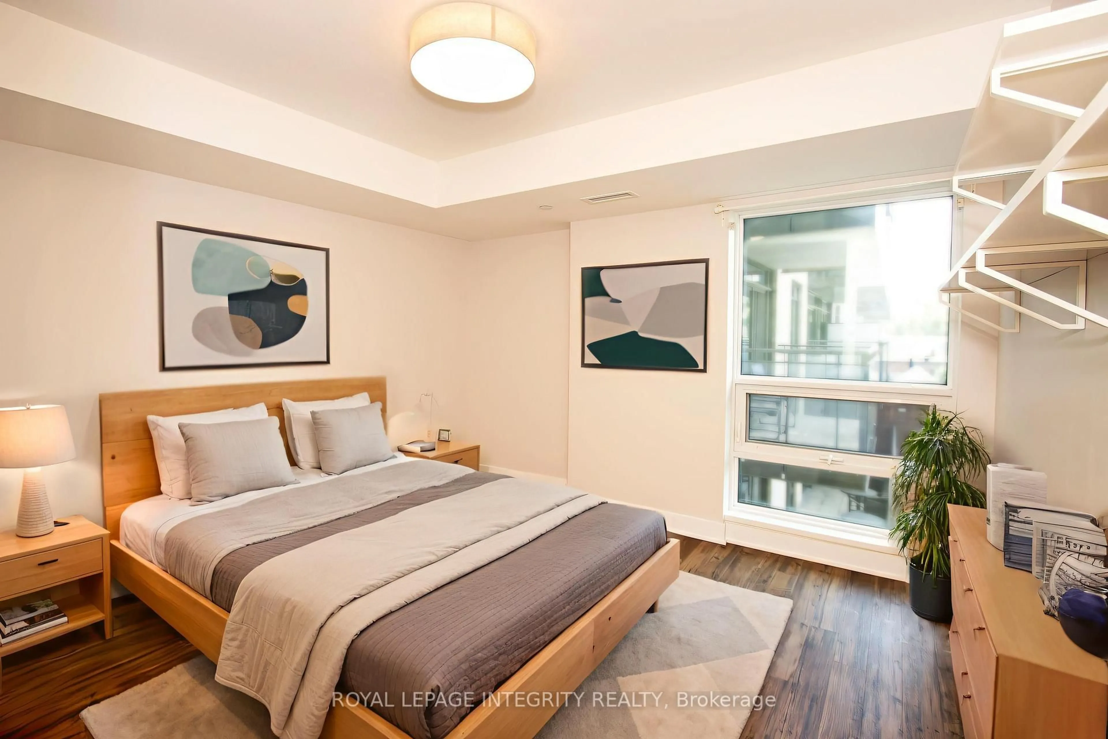 Bedroom with bed, wood/laminate floor for 411 Mackay St #318, Ottawa Ontario K1M 2C5