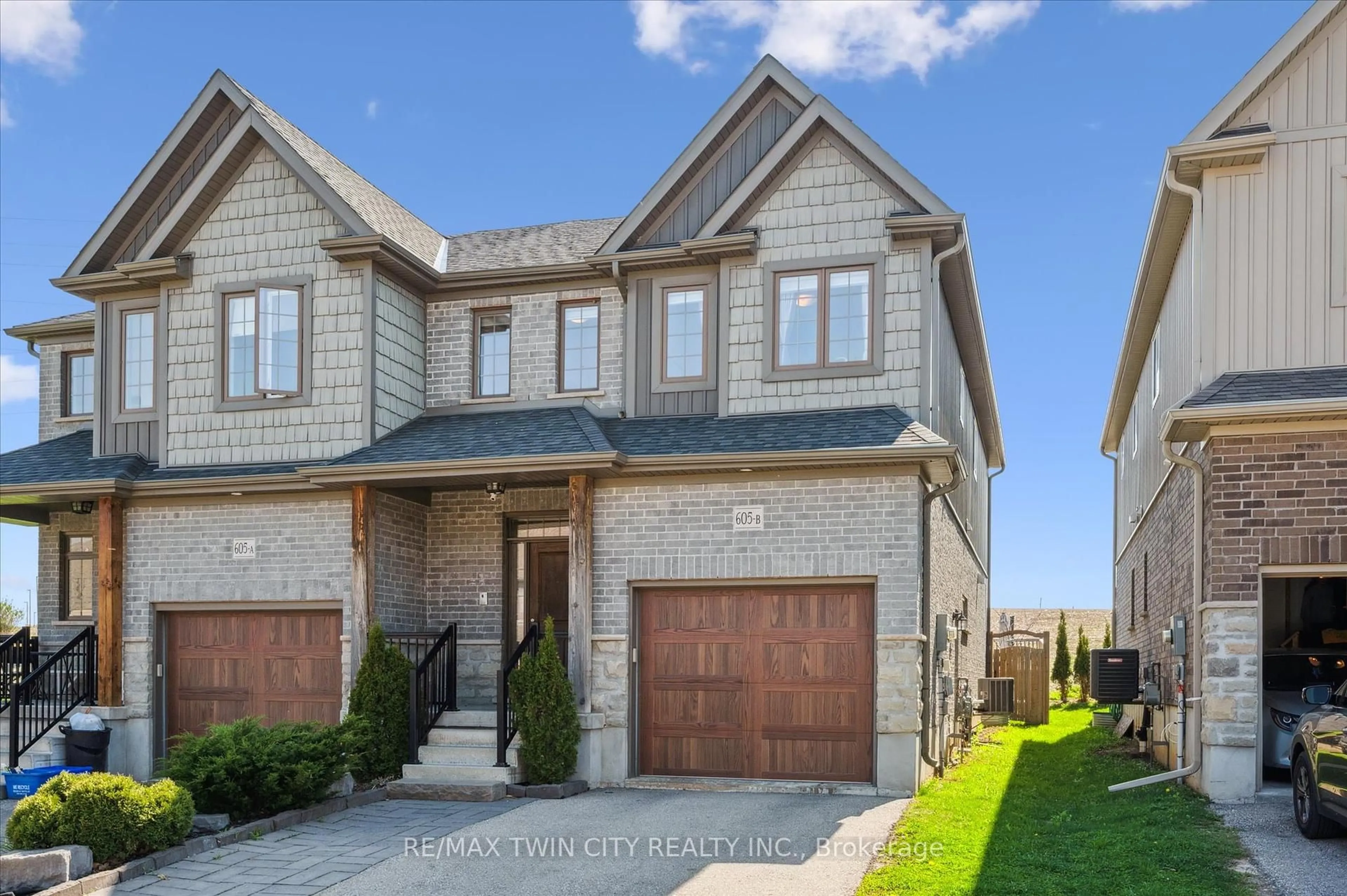Home with brick exterior material, street for 605 Montpellier Dr #B, Waterloo Ontario N2T 2Z4