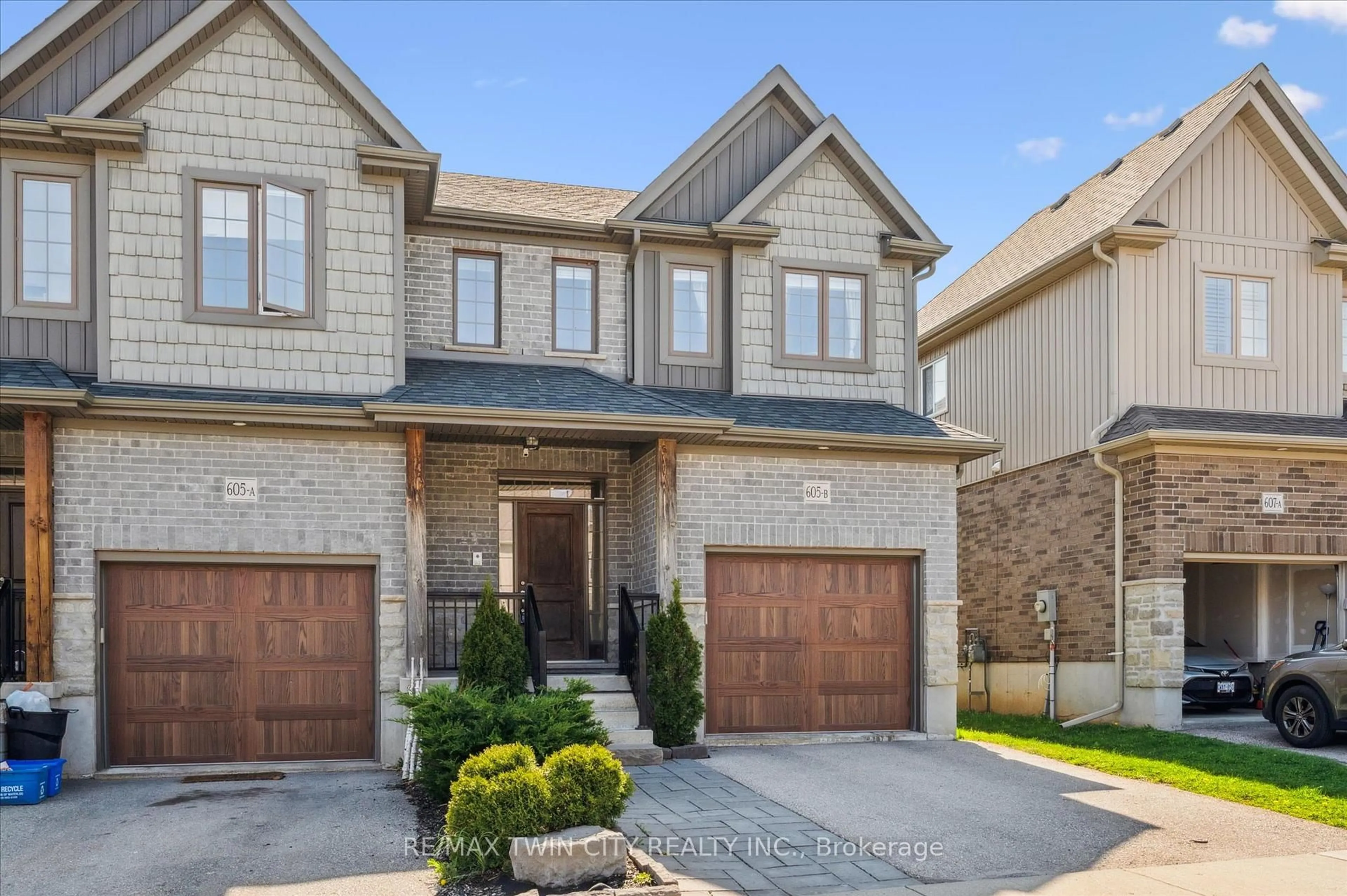 Home with brick exterior material, street for 605 Montpellier Dr #B, Waterloo Ontario N2T 2Z4