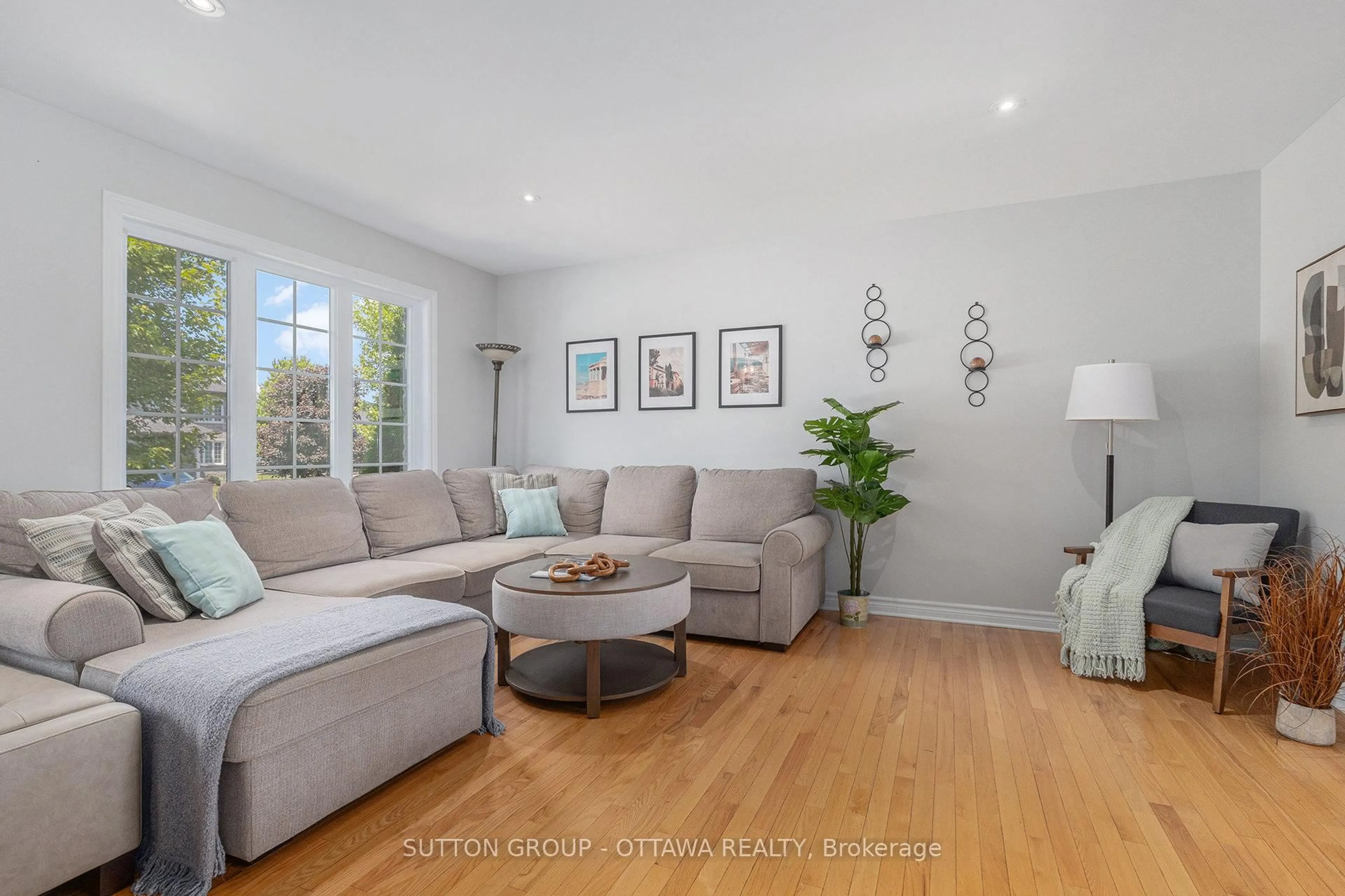 Living room with furniture, wood/laminate floor for 56 Honore Cres, The Nation Ontario K0A 2M0
