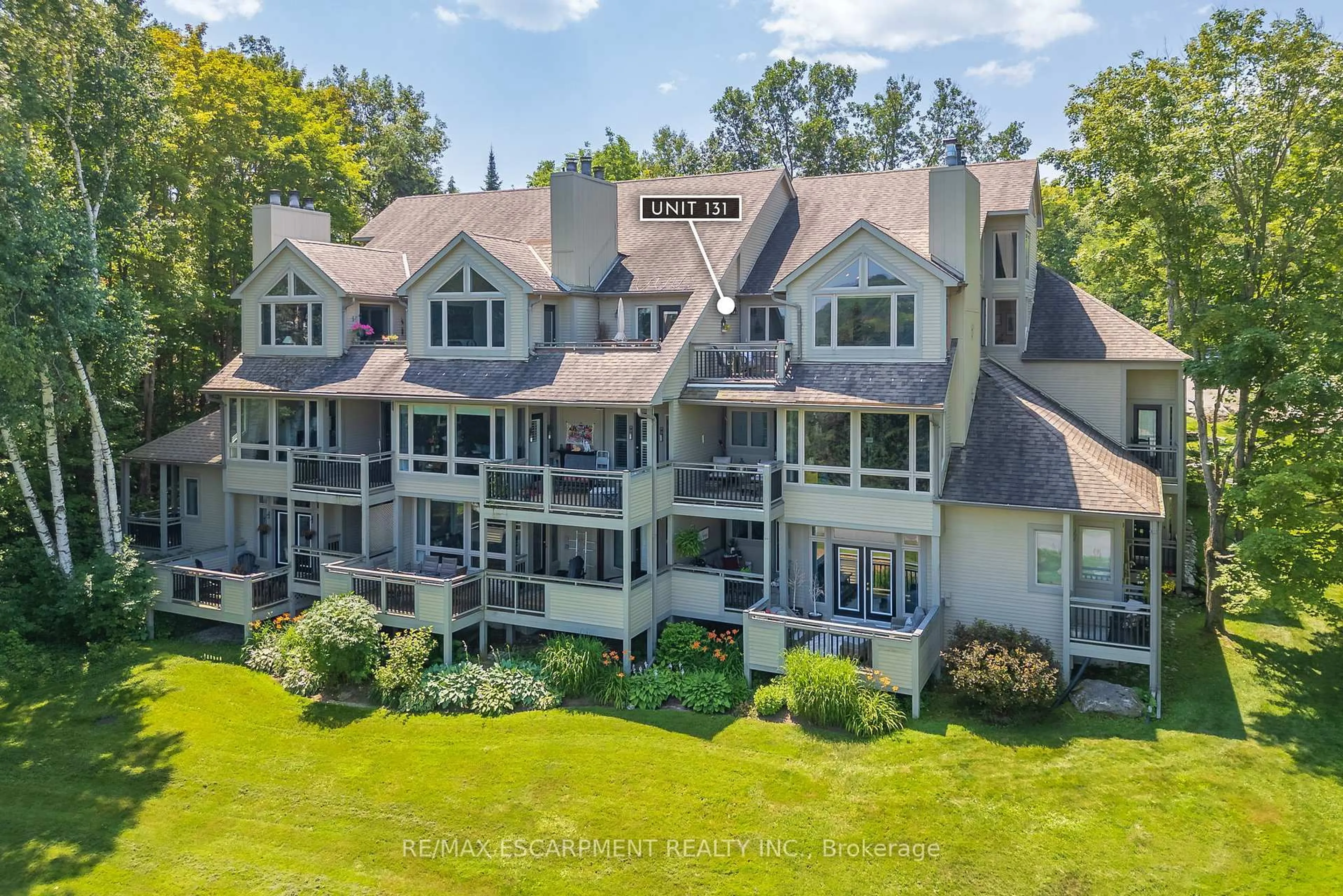 A pic from outside/outdoor area/front of a property/back of a property/a pic from drone, water/lake/river/ocean view for 131 Grandview Hilltop Dr #1, Huntsville Ontario P1H 2J5