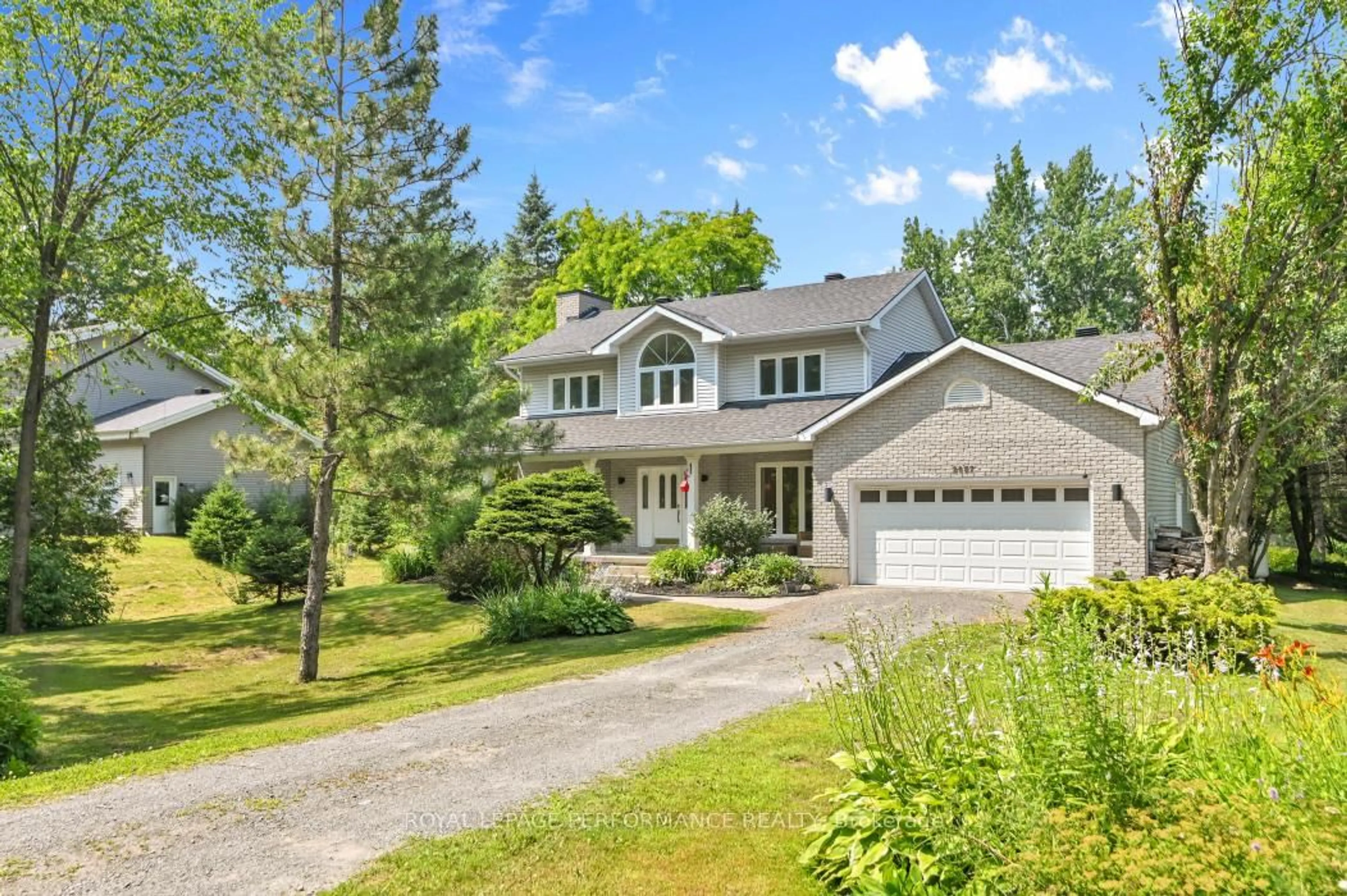 Home with vinyl exterior material, street for 2057 Clark Rd, Clarence-Rockland Ontario K4K 1K7