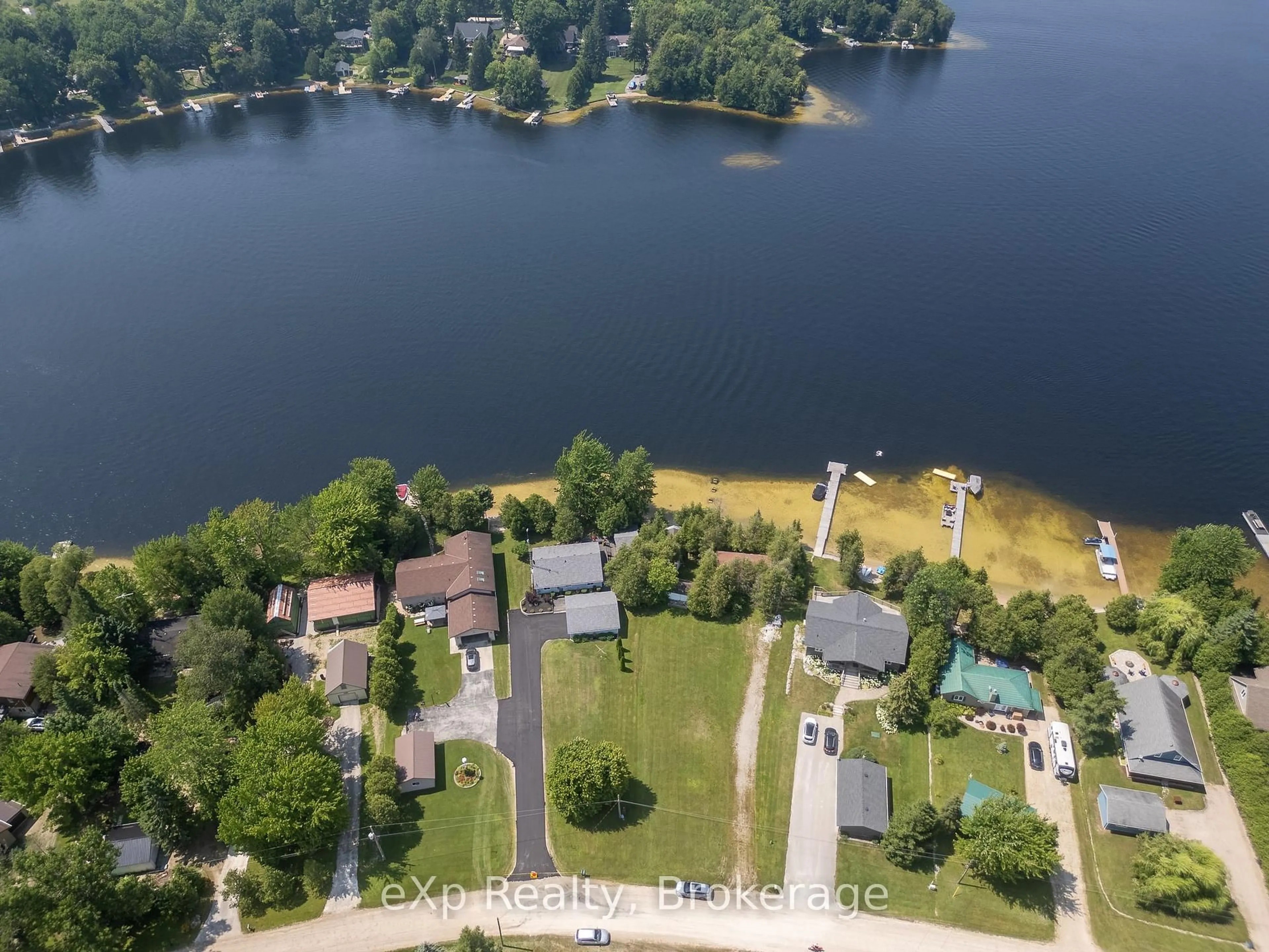 A pic from outside/outdoor area/front of a property/back of a property/a pic from drone, water/lake/river/ocean view for 204 McCullough Lake Dr, Chatsworth Ontario N0H 2V0