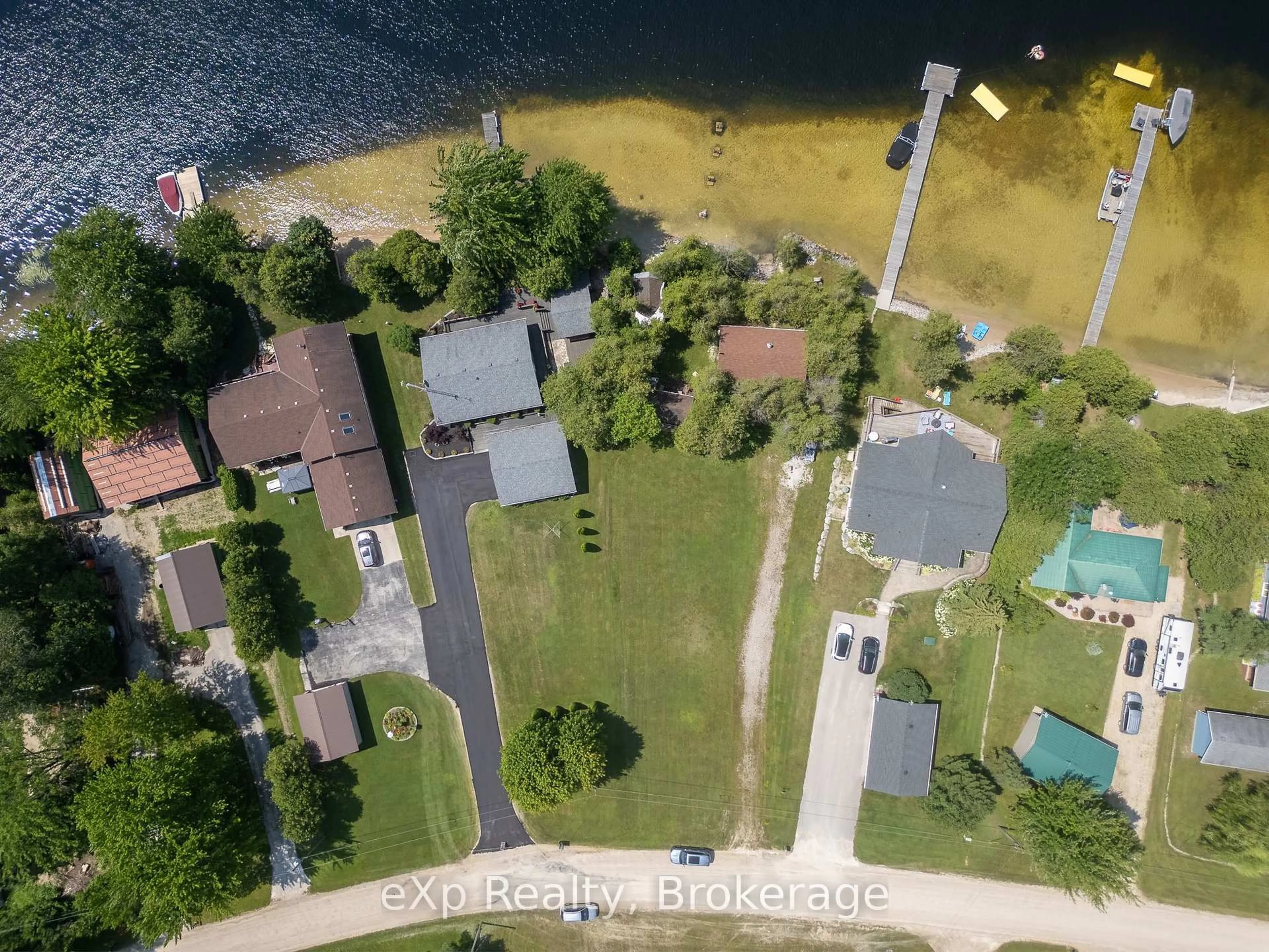 A pic from outside/outdoor area/front of a property/back of a property/a pic from drone, water/lake/river/ocean view for 204 McCullough Lake Dr, Chatsworth Ontario N0H 2V0