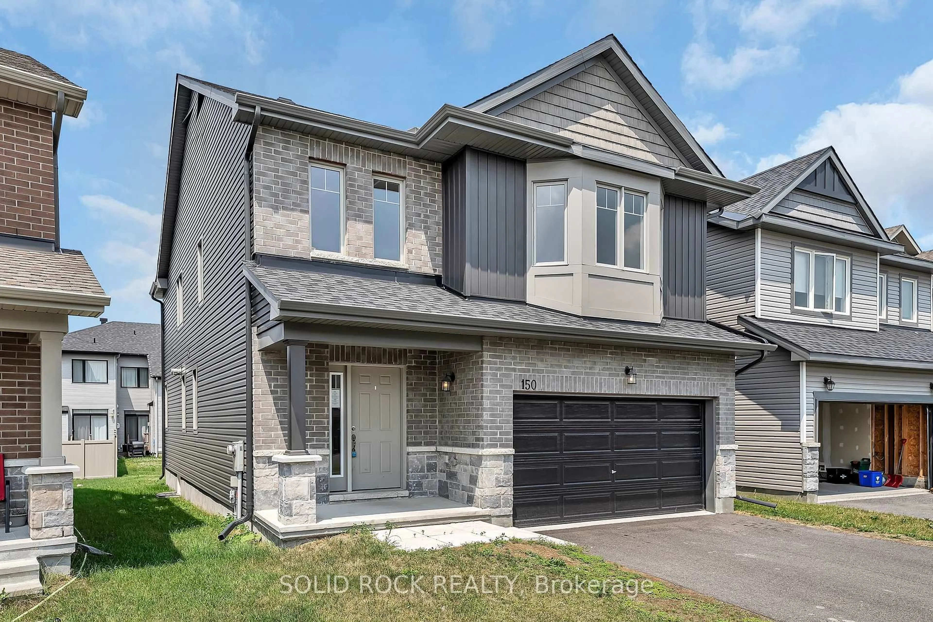 Home with brick exterior material, street for 150 Minikan St, Ottawa Ontario K1X 0E5