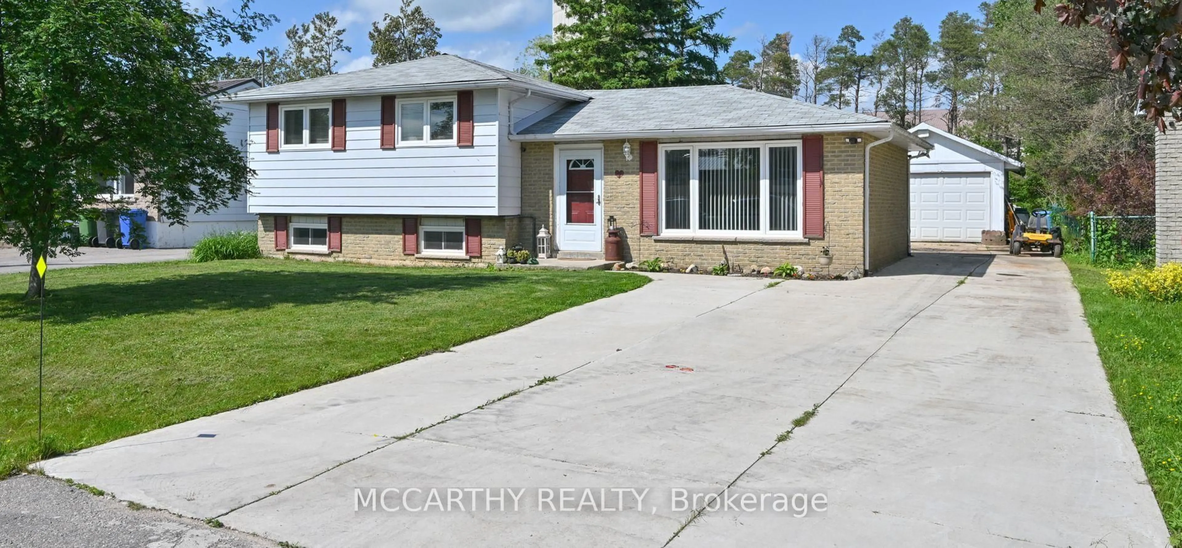 Home with vinyl exterior material, street for 7 McDowell St, Southgate Ontario N0C 1B0